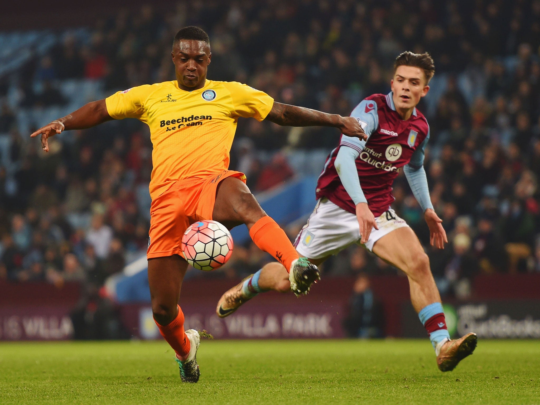 Jack Grealish tries to tackle Wycombe's Anthony Stewart