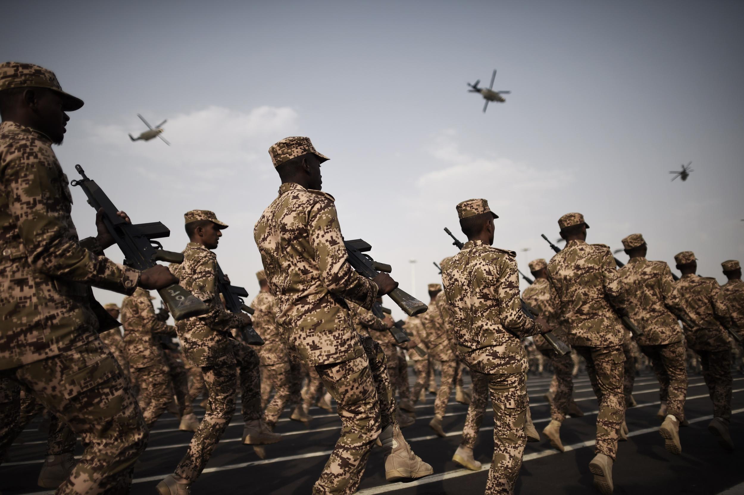 Members of the Saudi special police unit perform during a parade