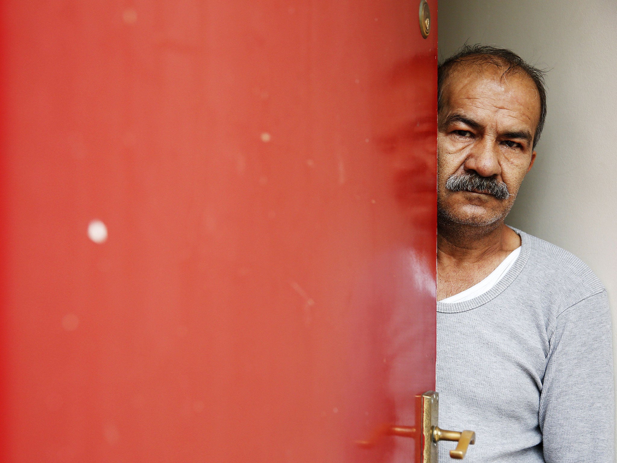 Iranian asylum seeker Mohammed Bagher Bayzavi at his front door in Union Street, Middlesbrough