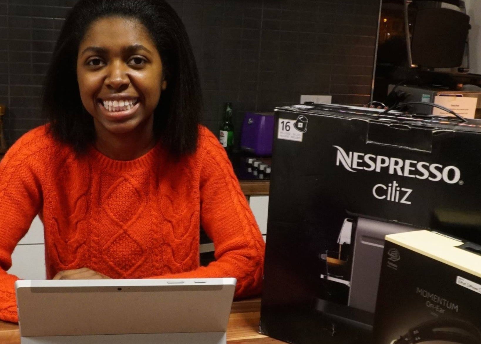 The student pictured with some of her high-tech prizes after spending up to 2 hours a day entering competitions