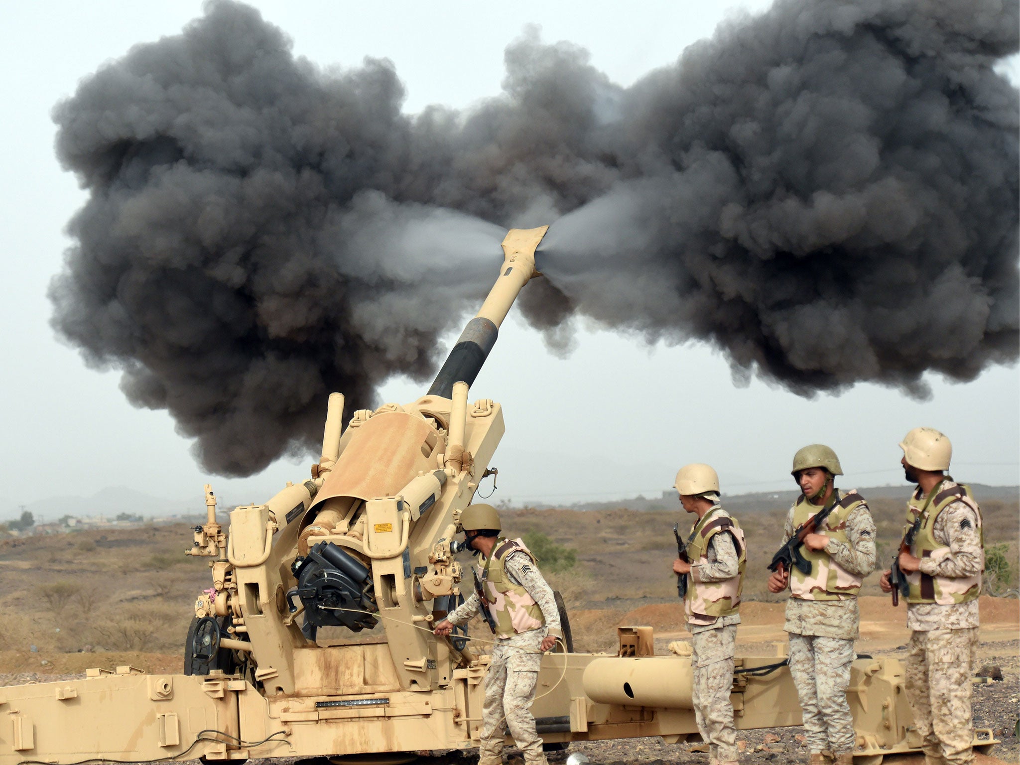 Saudi army artillery fire shells towards Yemen from a post close to the Saudi-Yemeni border, in southwestern Saudi Arabia, on 13 April, 2015