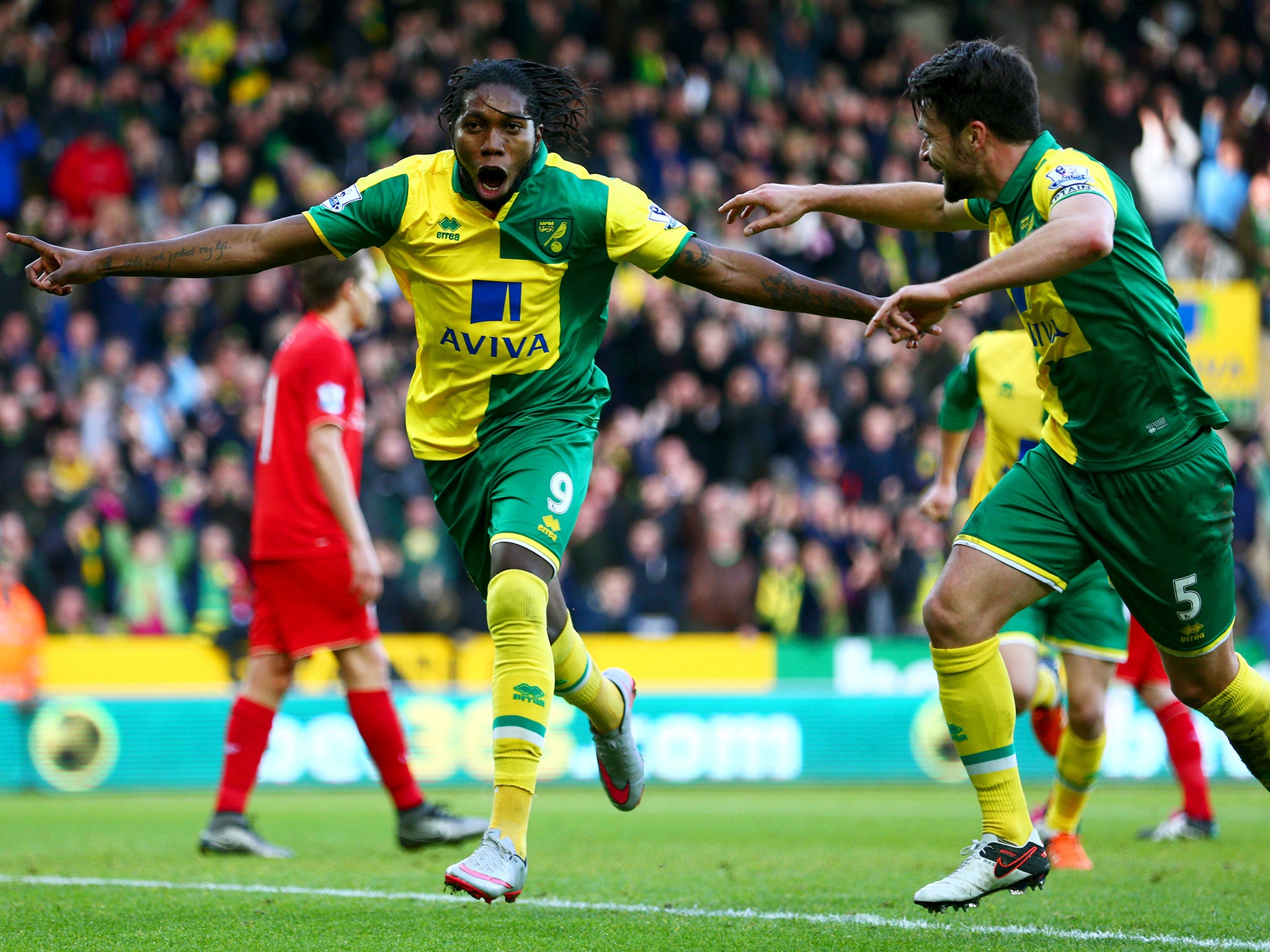 Dieumerci Mbokani celebrates after equalising against Liverpool