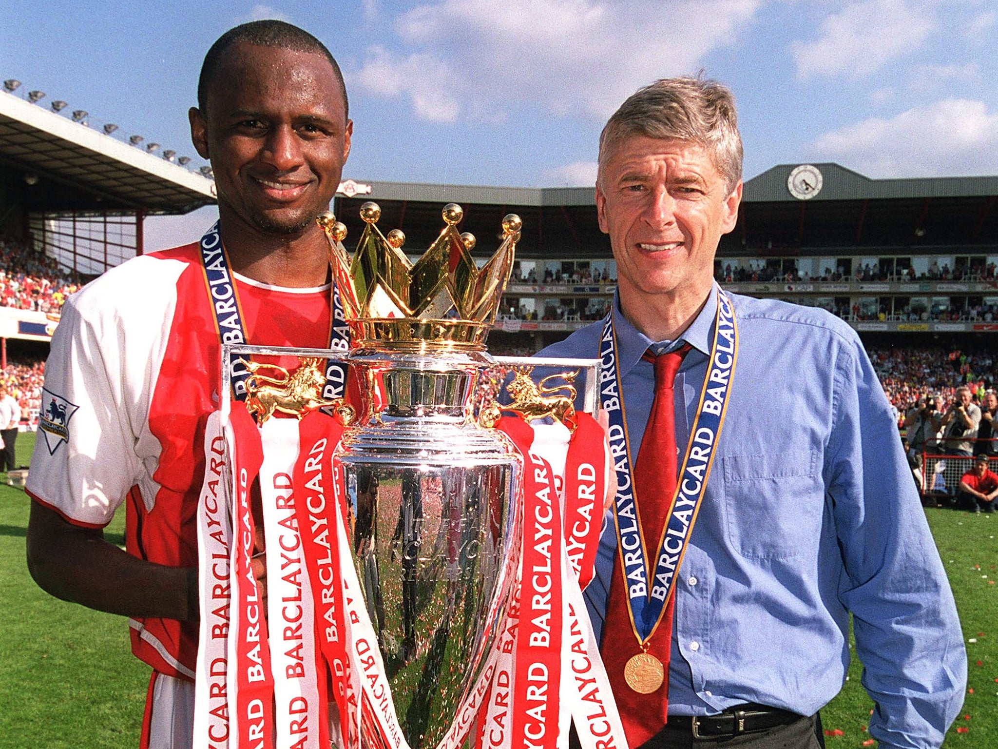 &#13;
Arsene Wenger with one of three Premier League titles&#13;