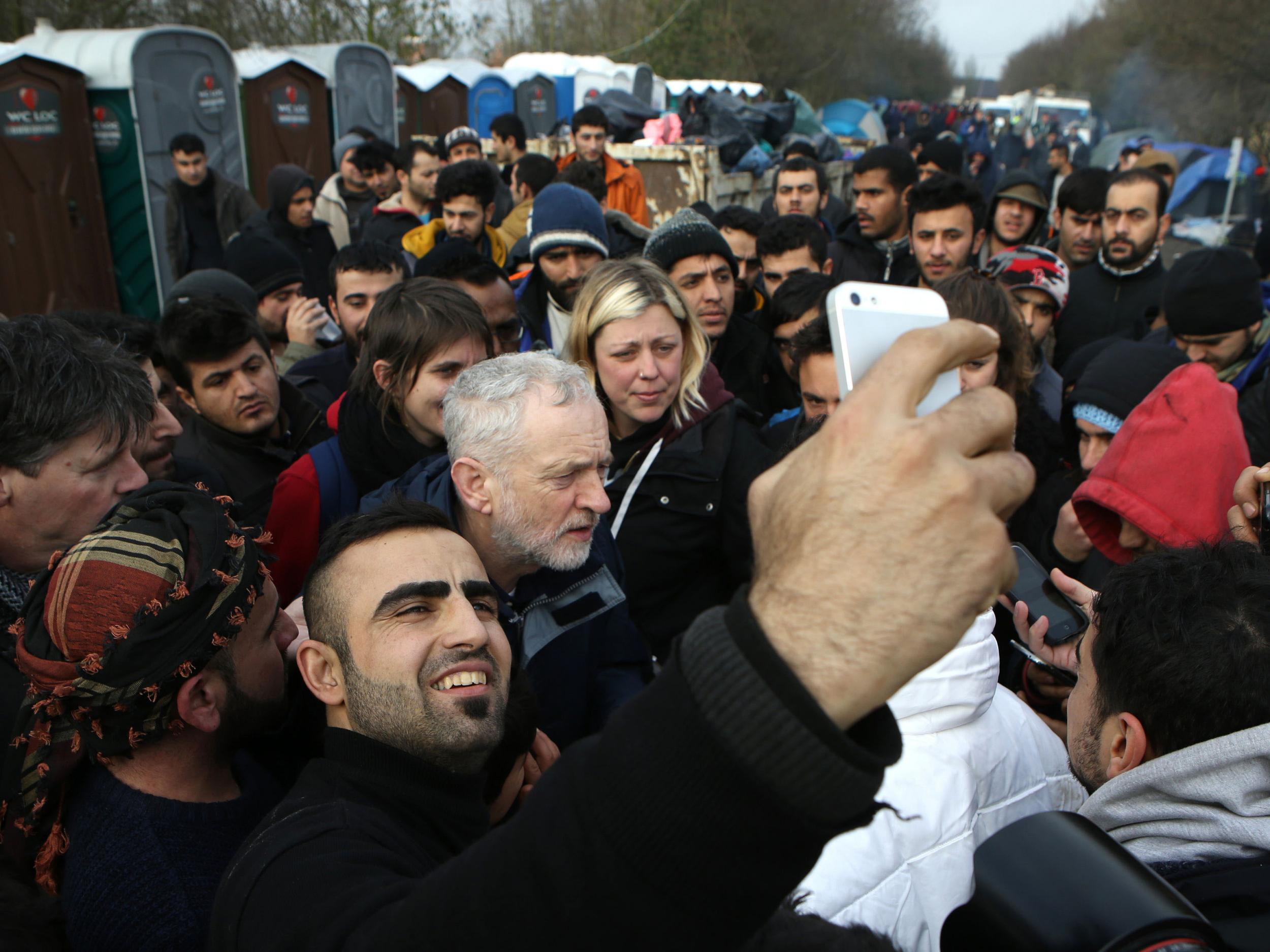 Jeremy Corbyn is surrounded by refugees at the Grande-Synthe camp near Dunkirk