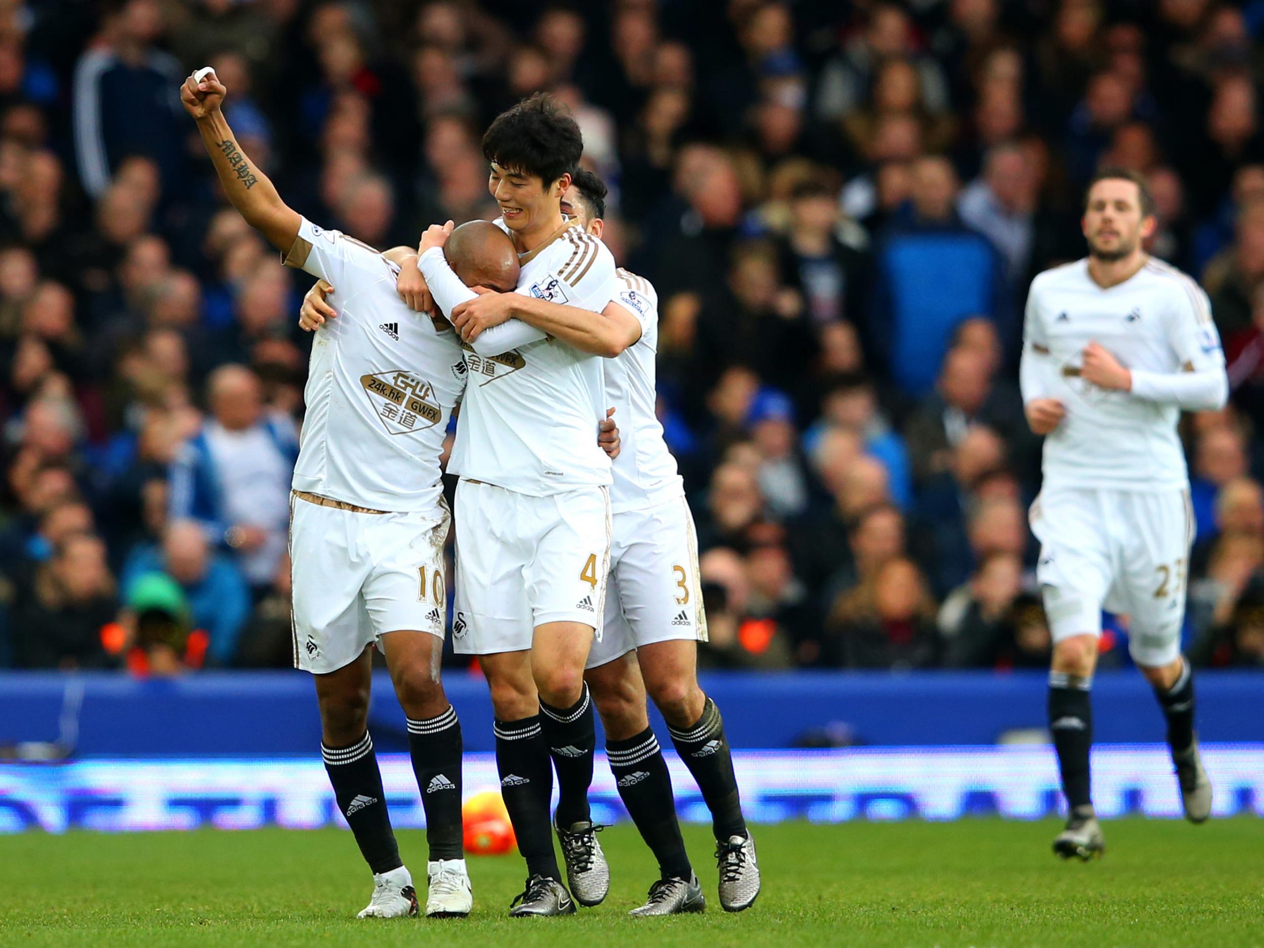 Andre Ayez is congratulated after scoring the Swans' winner