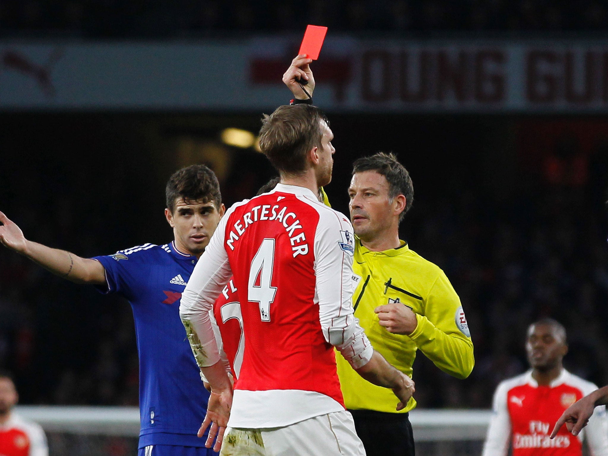 Per Mertesacker is dismissed by Mark Clattenburg