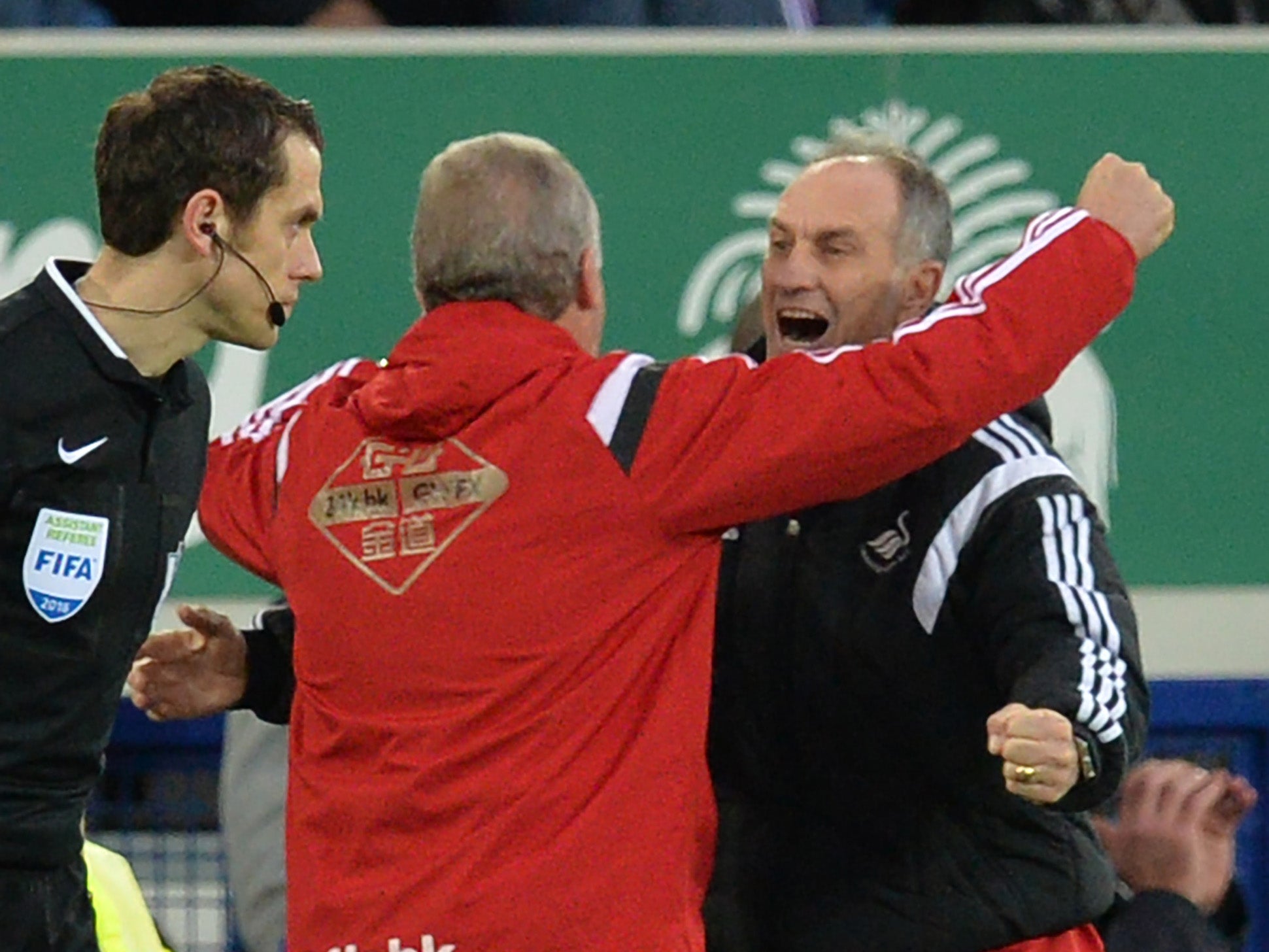 Francesco Guidolin is congratulated by his backroom team