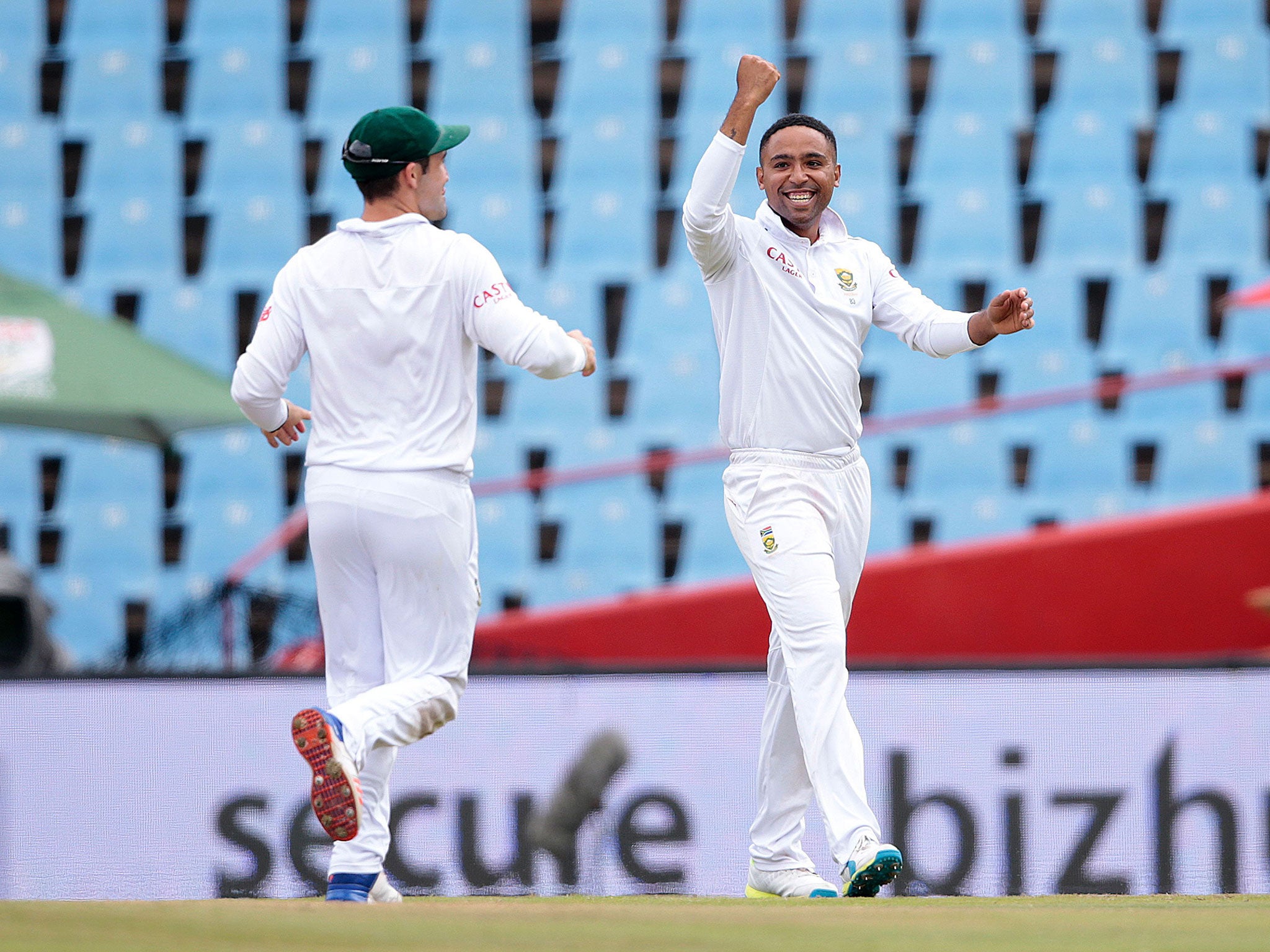 Dane Piedt celebrates taking the wicket of Joe Root