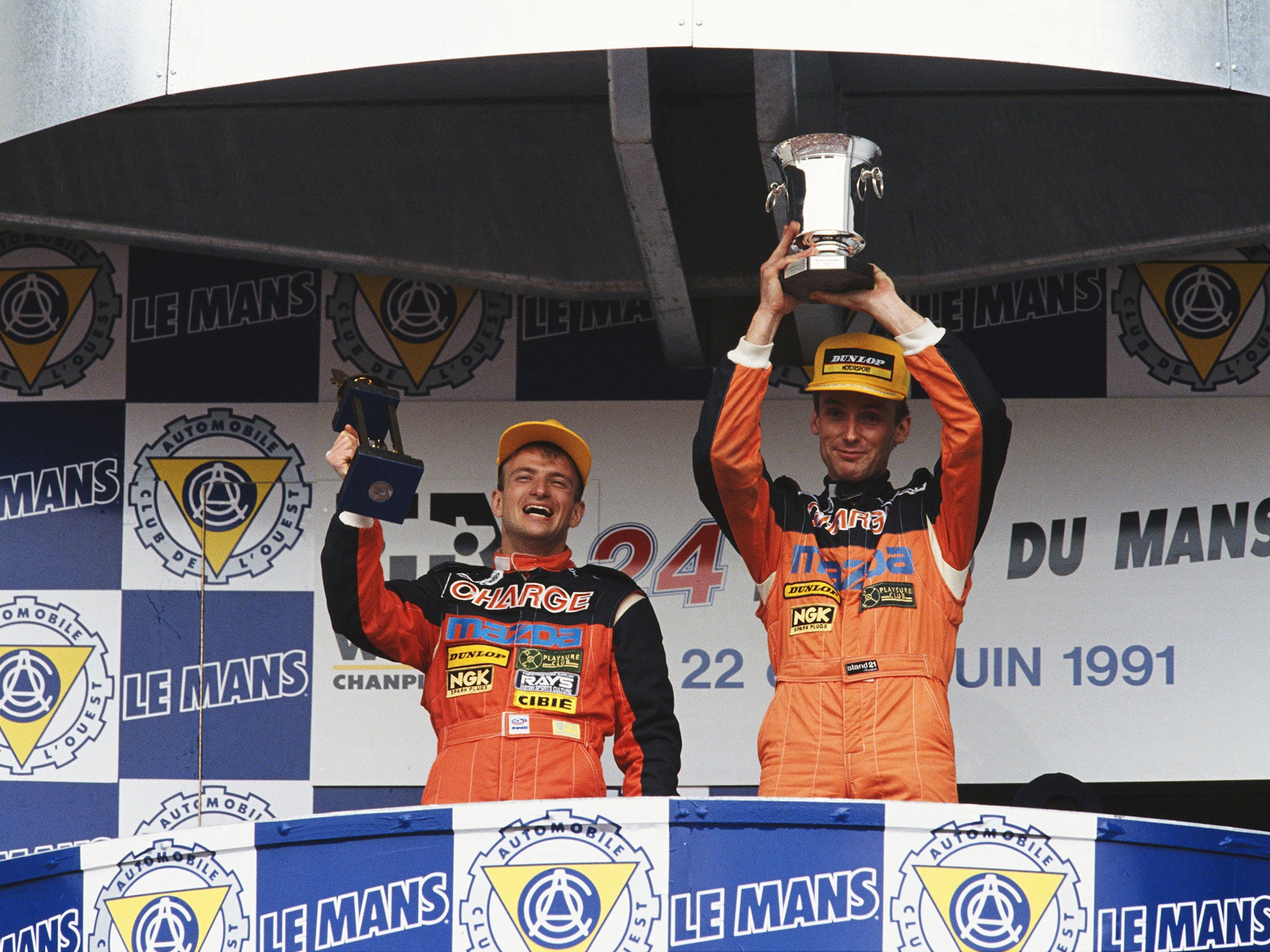 Herbert's team-mates Volmer Weidler and Bertrand Gachot on the Le Mans podium after the race