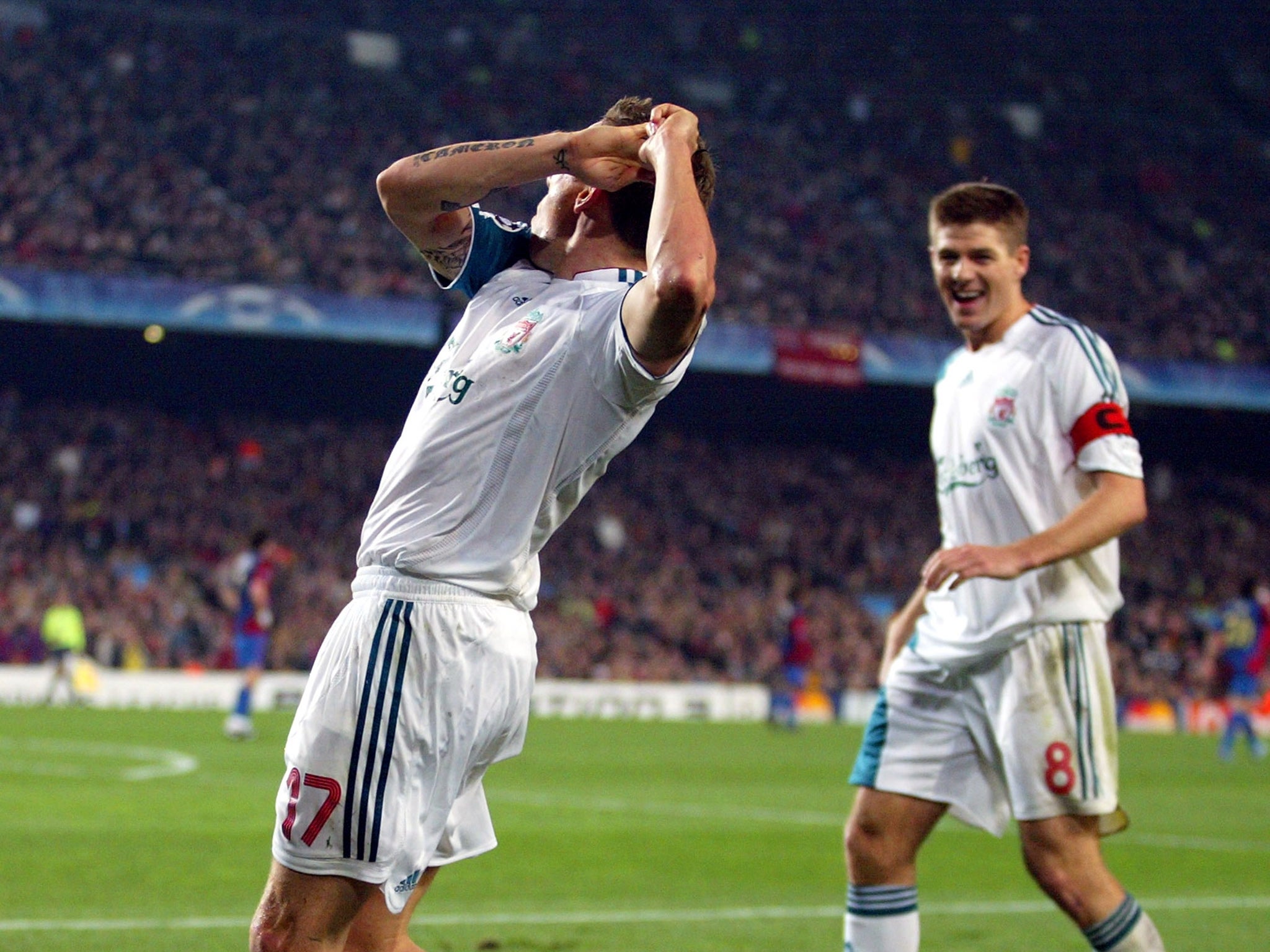 Craig Bellamy celebrates scoring against Barcelona with a golf swing