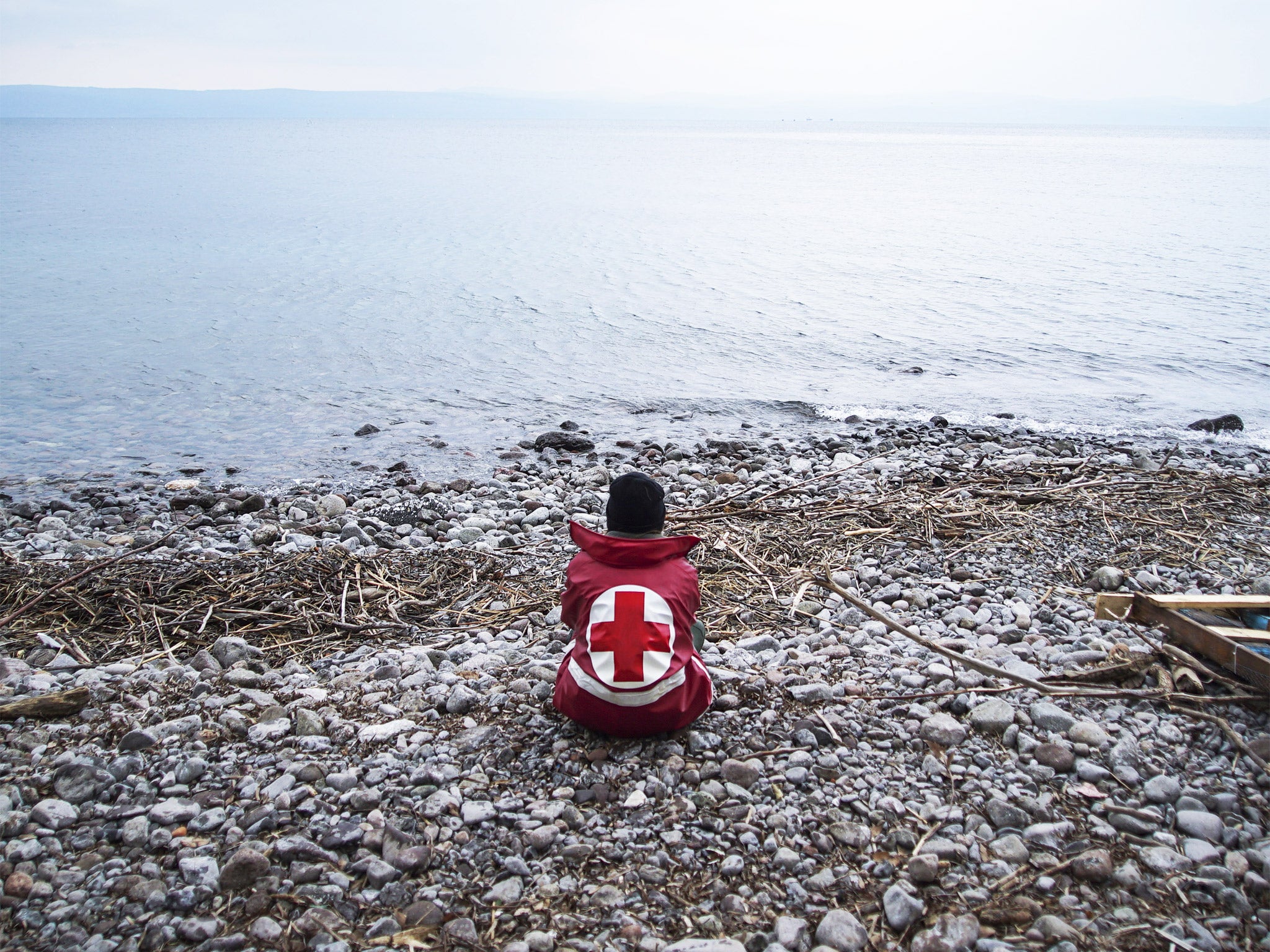 A member of the Greek Red Cross awaiting more refugee arrivals on the island of Lesbos this week