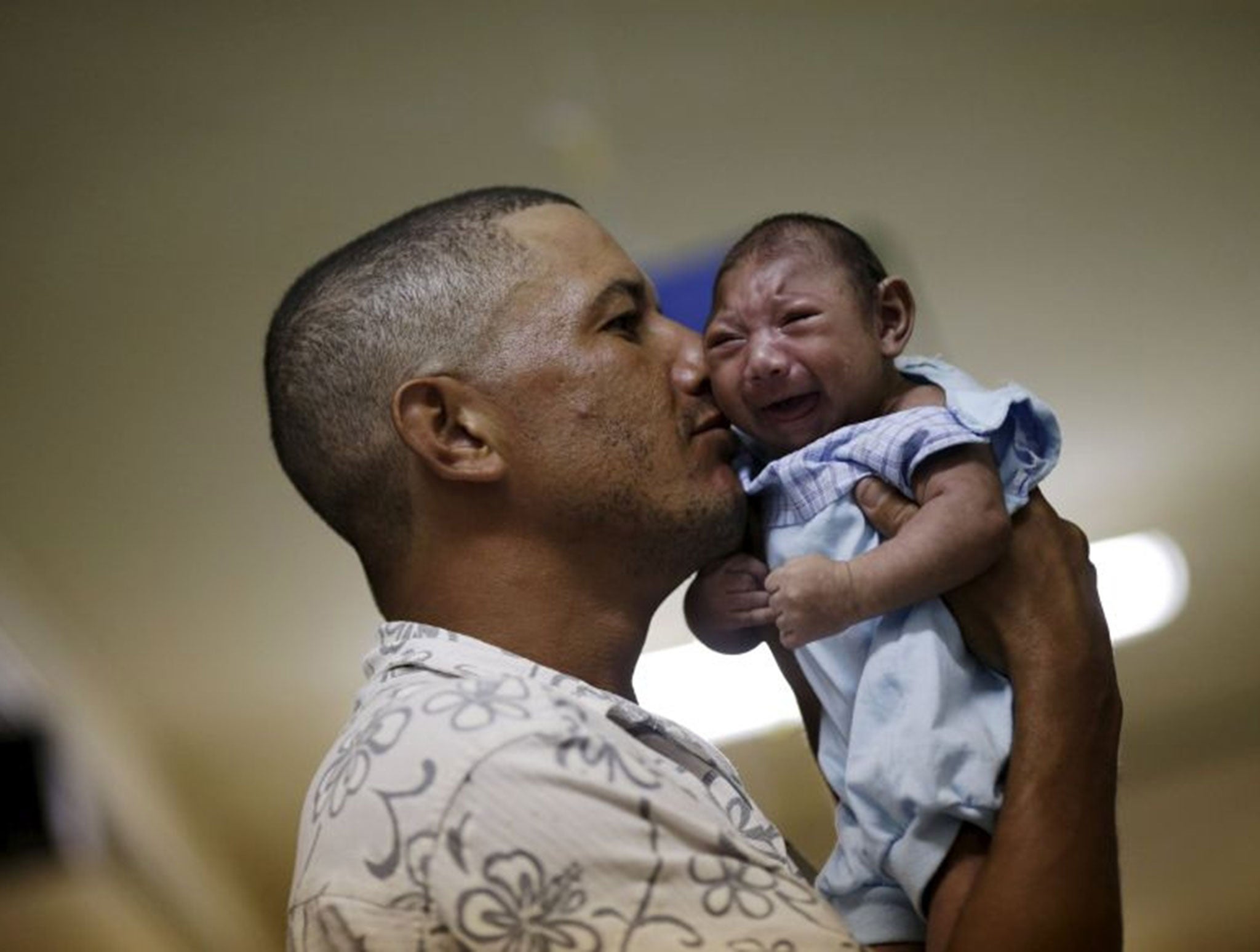 Geovane Silva holds his son Gustavo Henrique, who has microcephaly, at the Oswaldo Cruz Hospital in Recife, Brazil