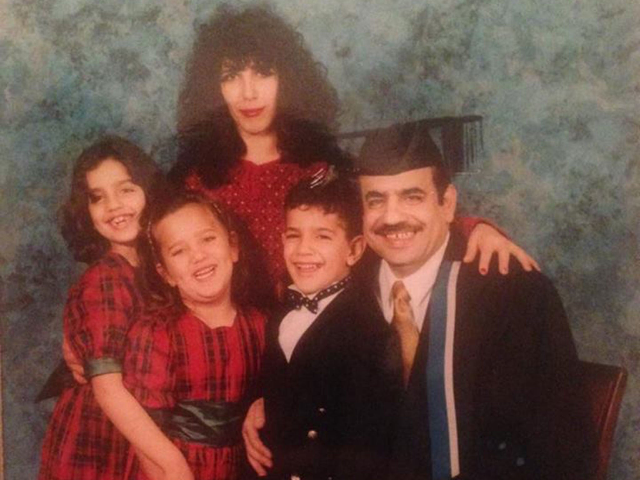 Mo (centre) with his parents and two sisters