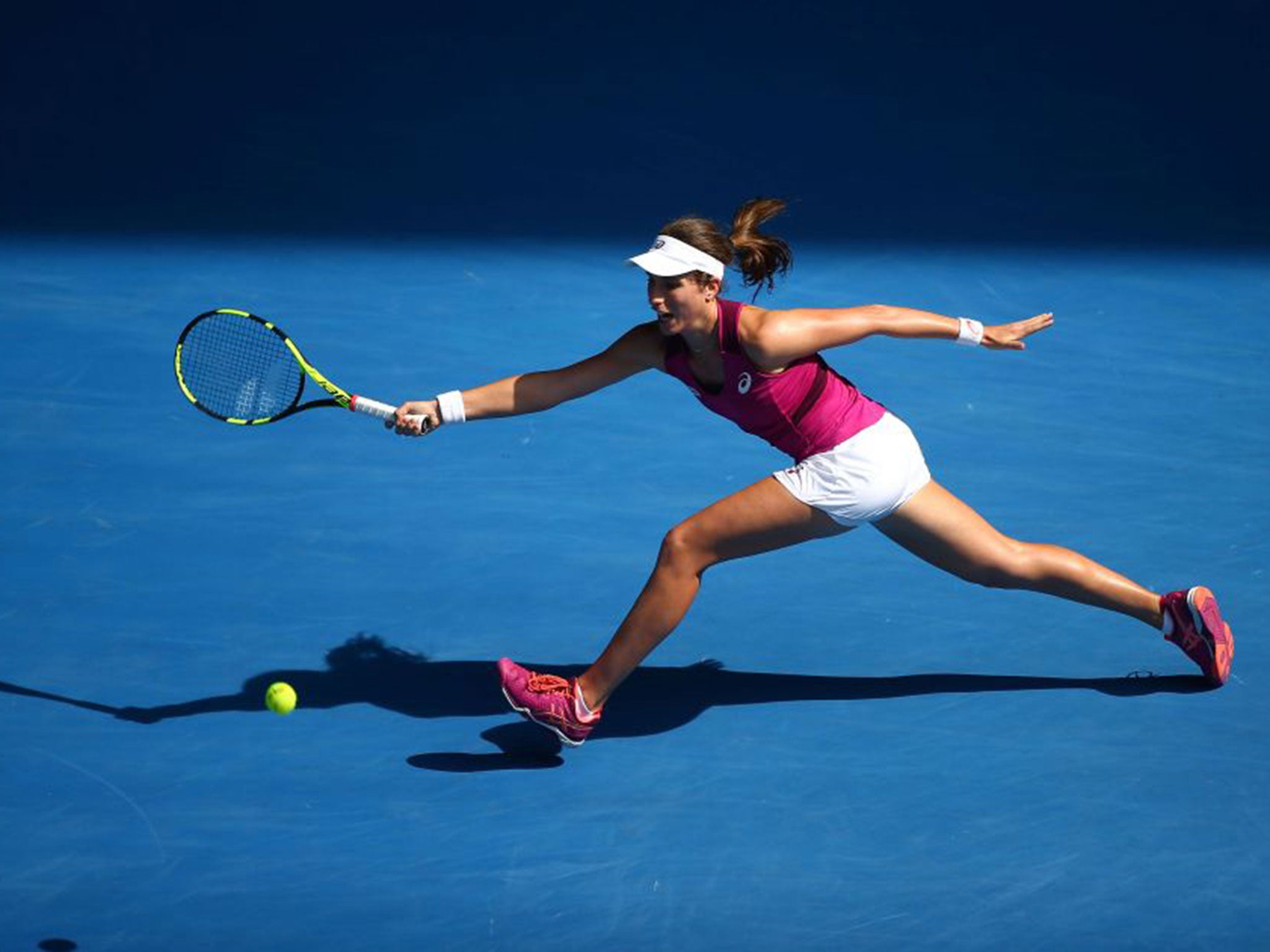 Johanna Konta scrambles to make a return against Angelique Kerber
