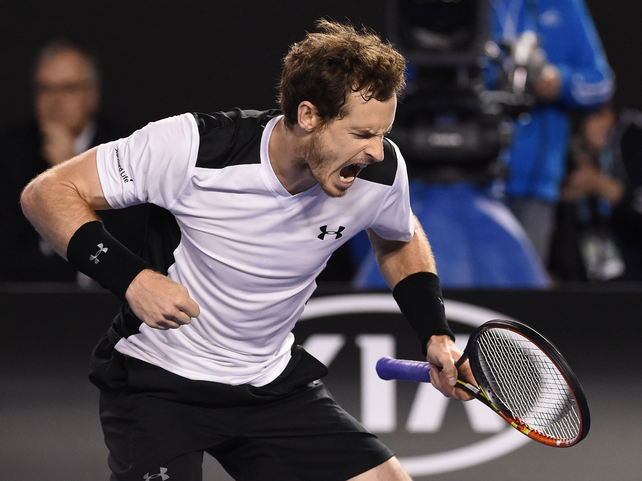 Andy Murray celebrates breaking Milos Raonic in the fourth set