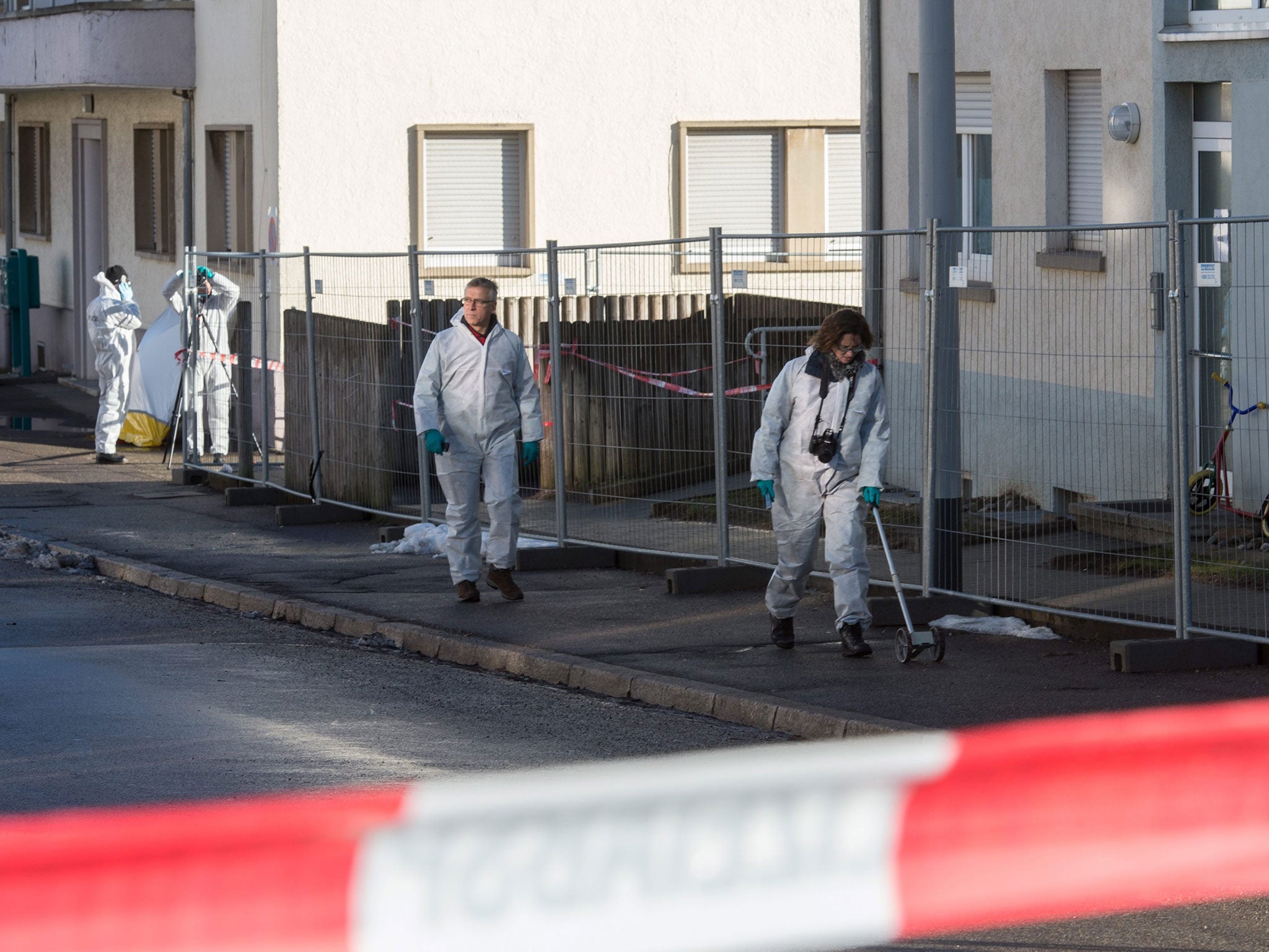 Police officers of the crime scene investigation unit examine a refugee shelter in Villingen-Schwenningen, Germany, 29 January 2016.