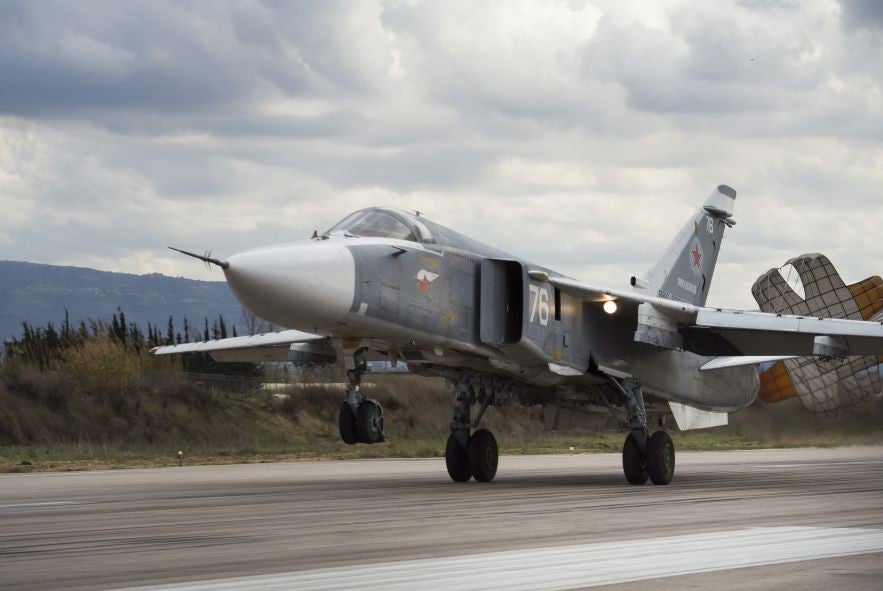 An Su-24 bomber – which has its origins in the late 1960s – lands at Hemeimeem air base in Syria