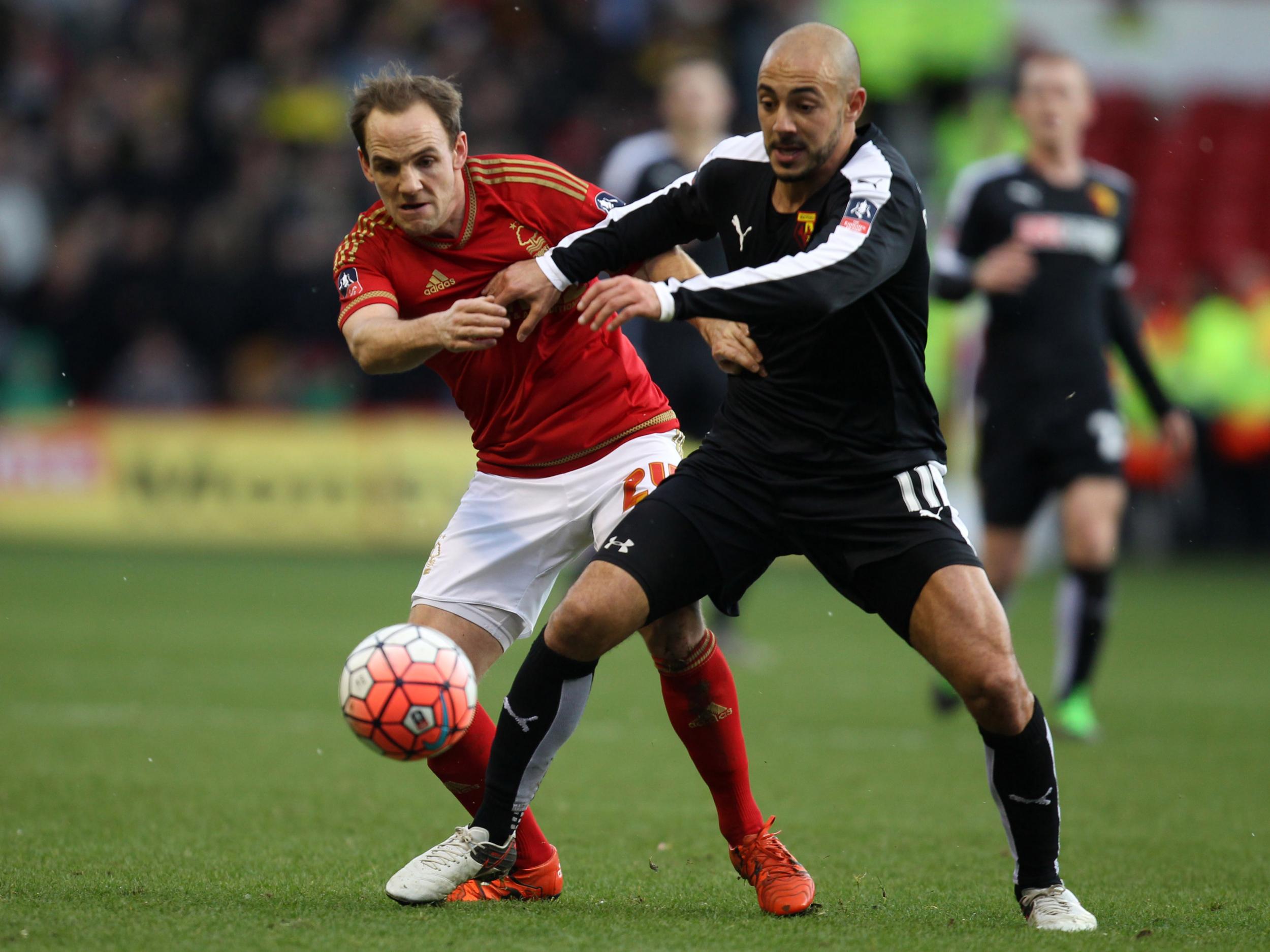 David Vaughan wrestles for possession