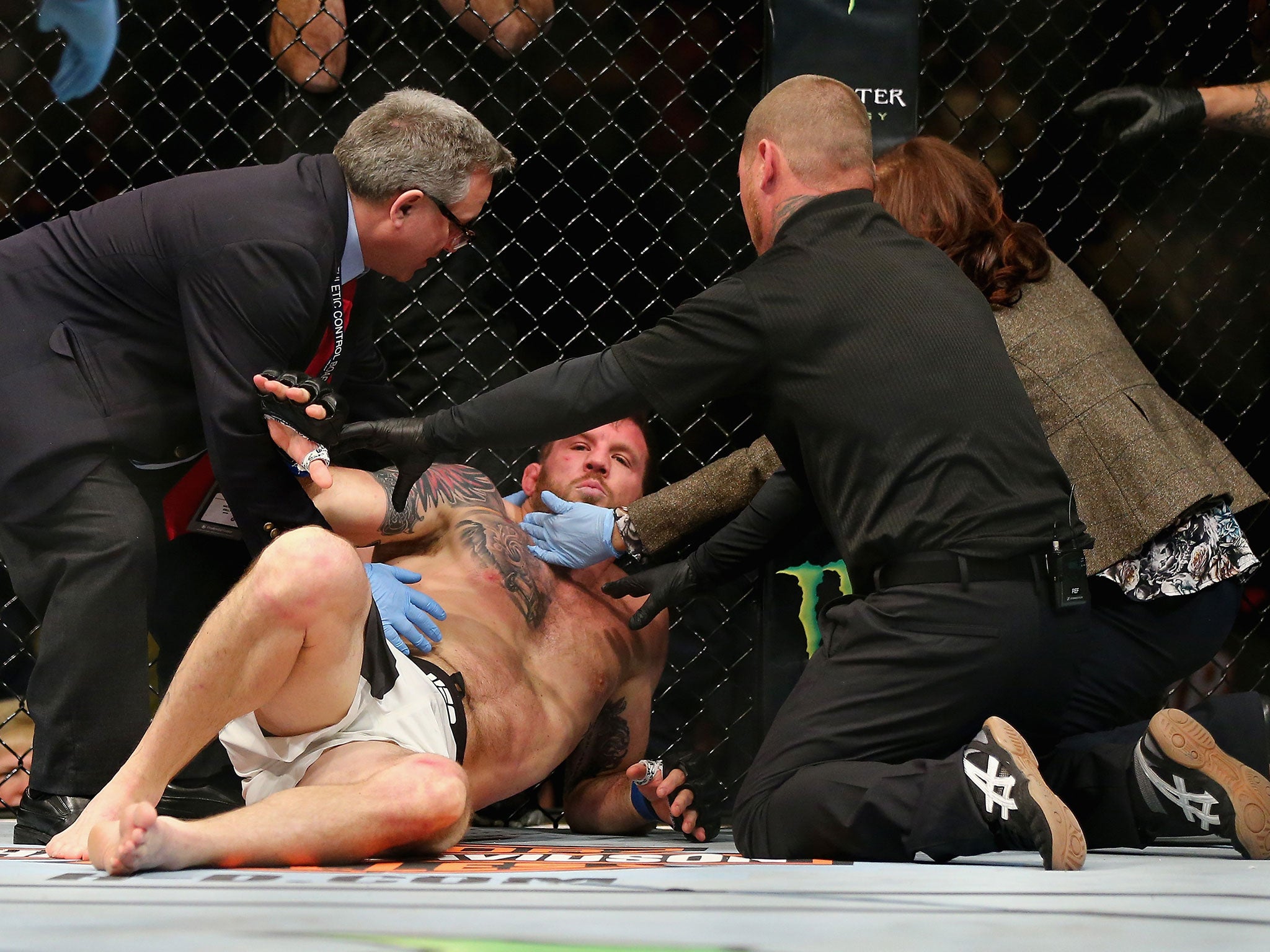 Ryan Bader is treated by medics after being knocked out by Ryan Johnson