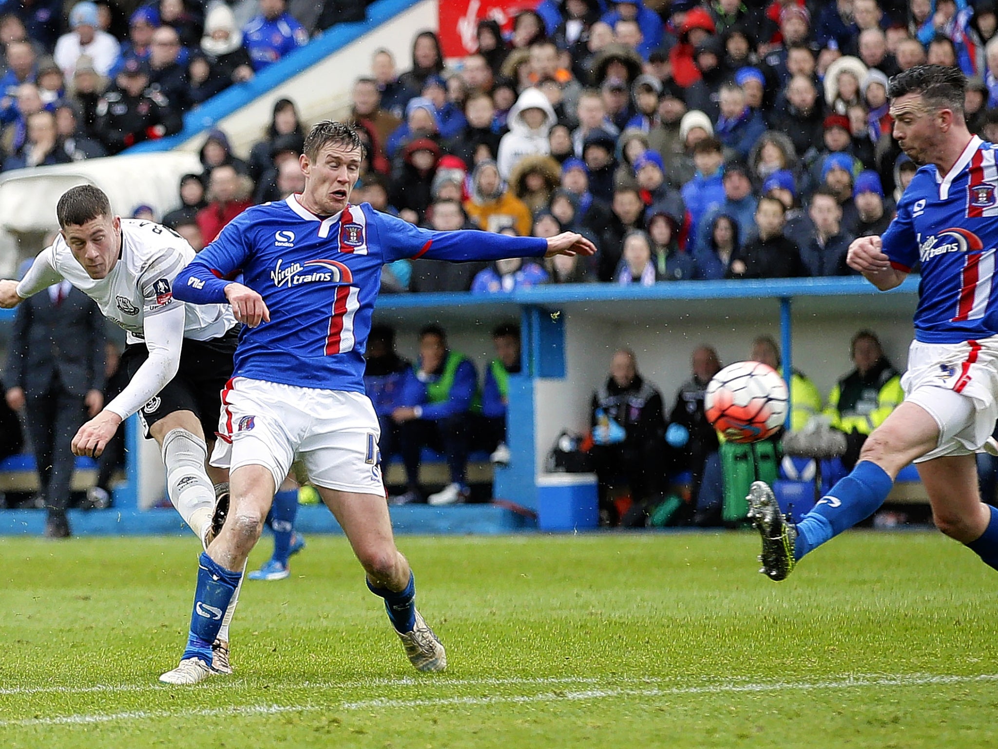 Ross Barkley (left) scores Everton’s third goal at Brunton Park