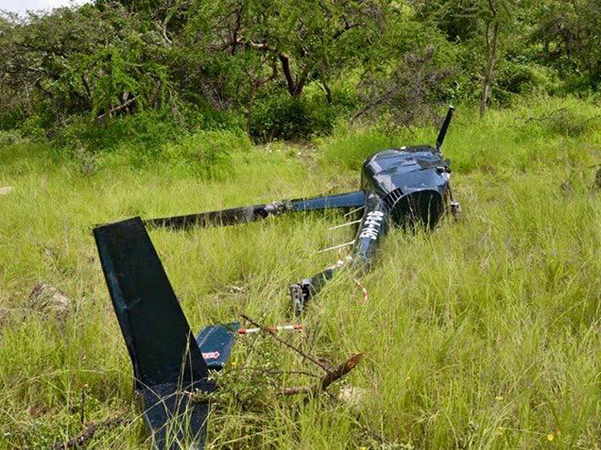 The wreckage of the helicopter, which bore a bullet hole in the pilot’s seat