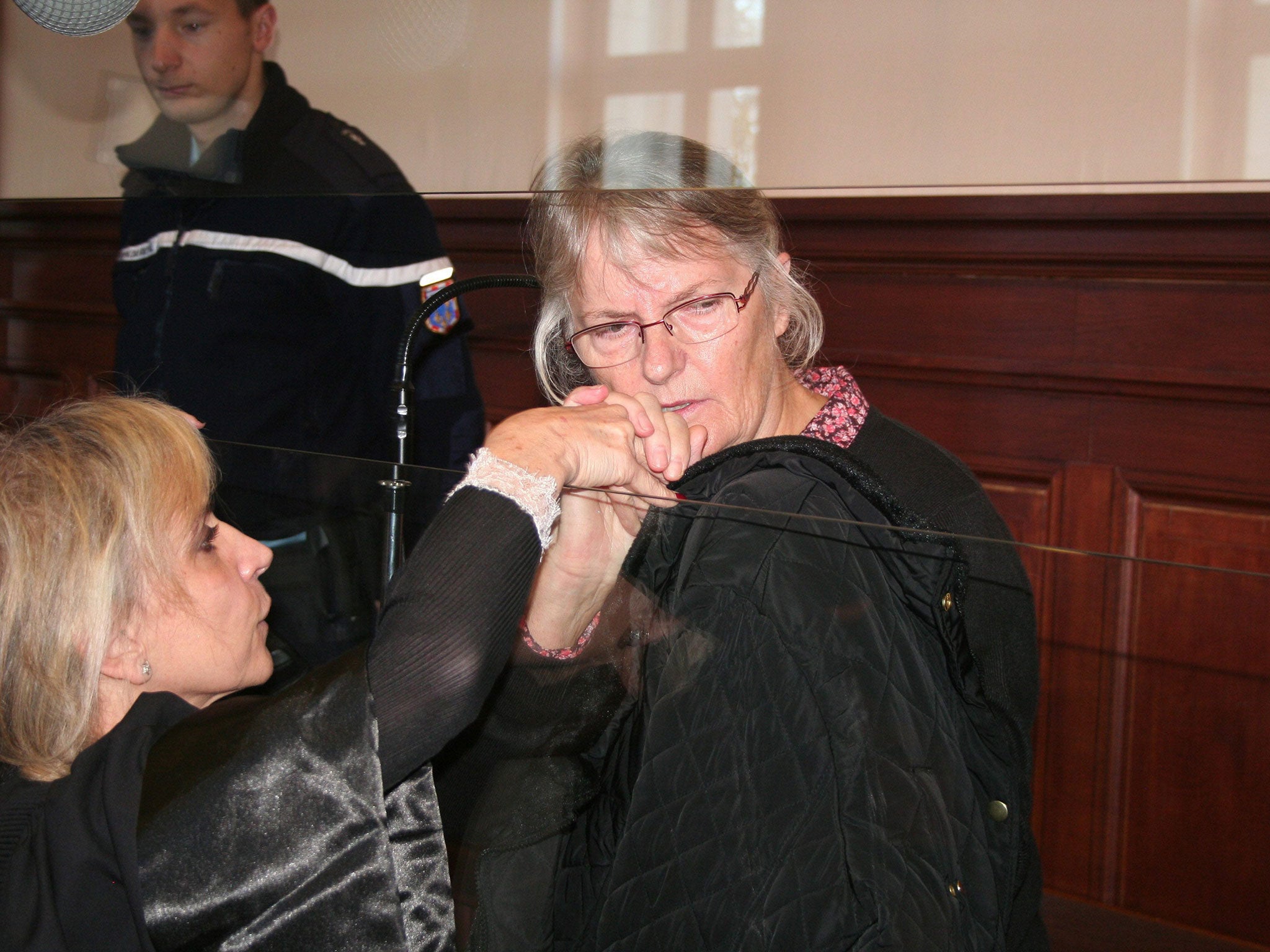 Jacqueline Sauvage, centre, a French woman convicted of murdering her abusive husband, in Blois, France. French President Francois Hollande pardoned Jacqueline Sauvage after a clemency plea by her children