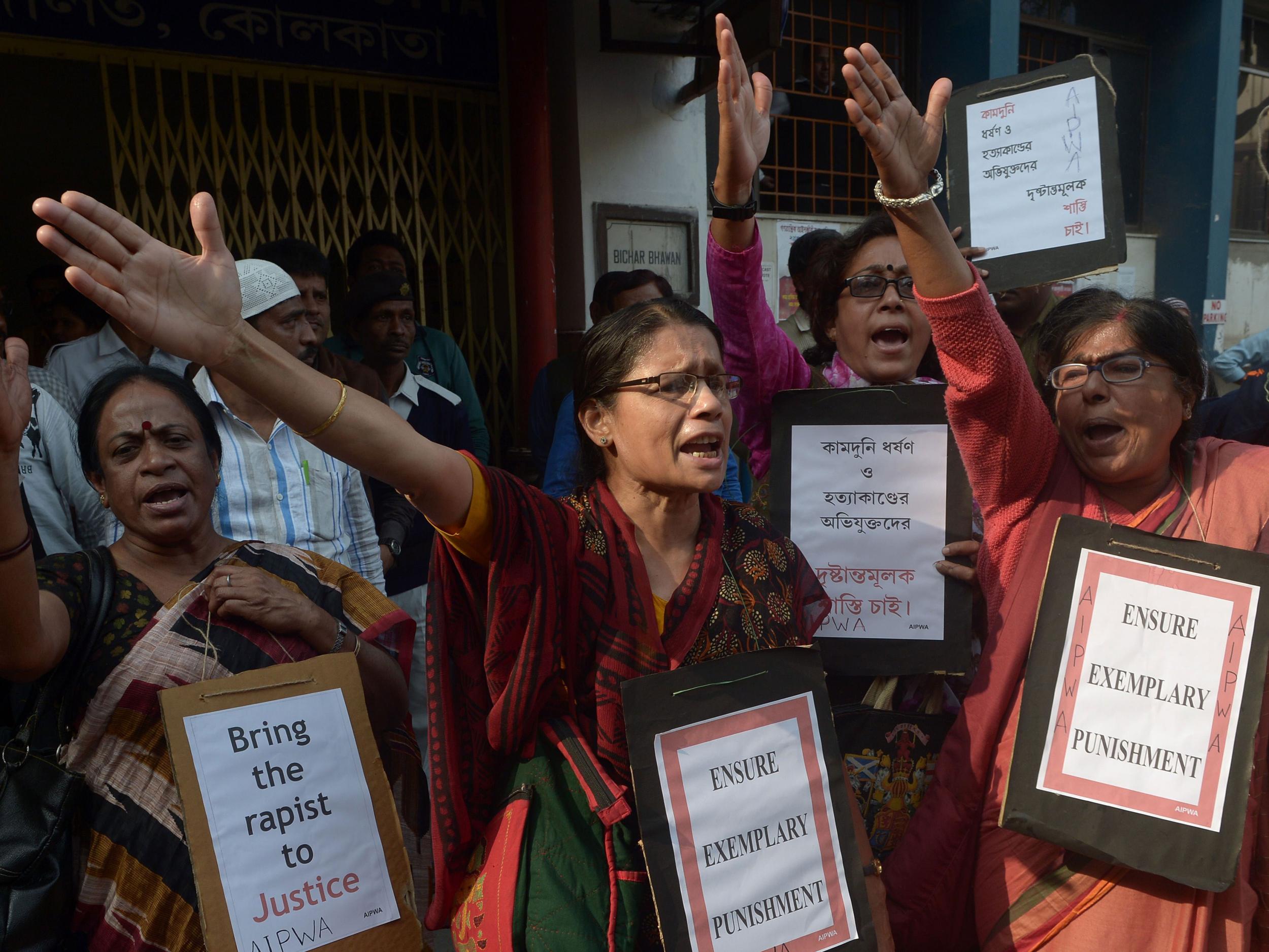 Social activists shout slogans against the judgment of the rape and murder case of Kamduni