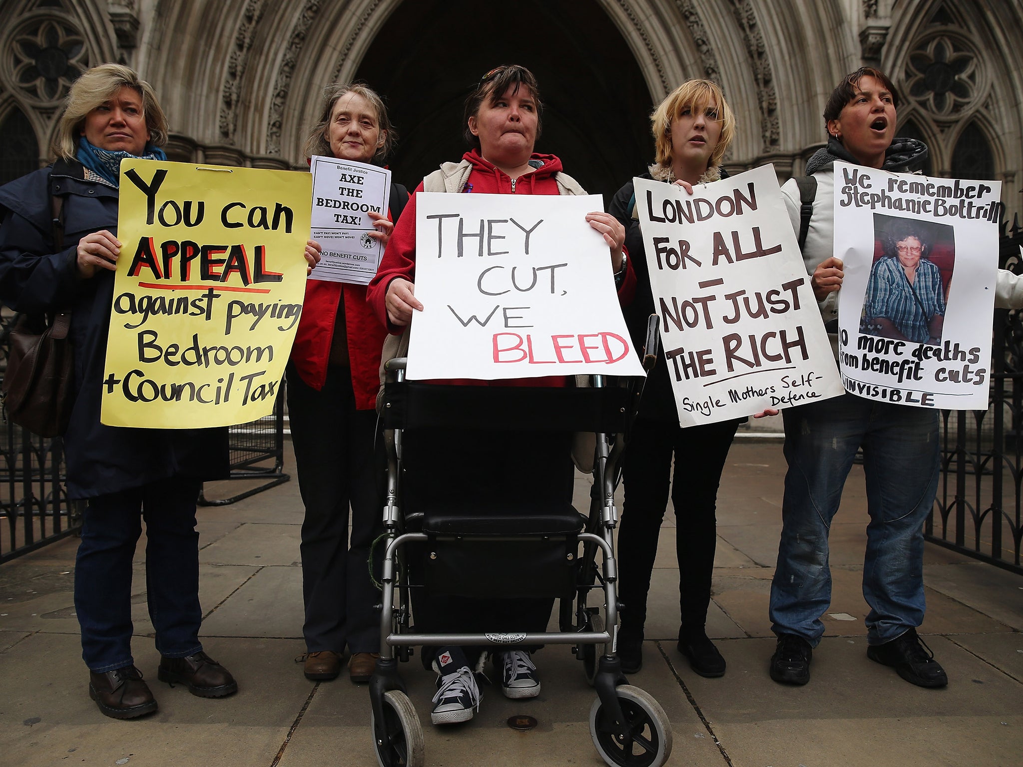 Demonstrators protesting against government changes to the welfare system and the proposed 'Bedroom Tax' outside the High Court in 2013