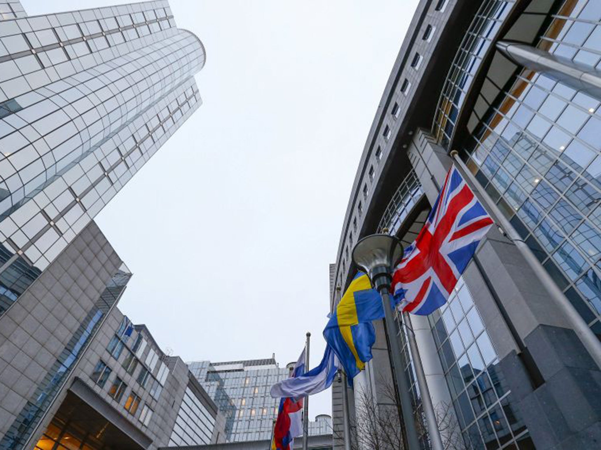 The Union flag flies next to others outside of the European Parliament. There is growing optimism in London and Brussels that David Cameron and the other 27 EU leaders could reach a deal at a summit on later this month