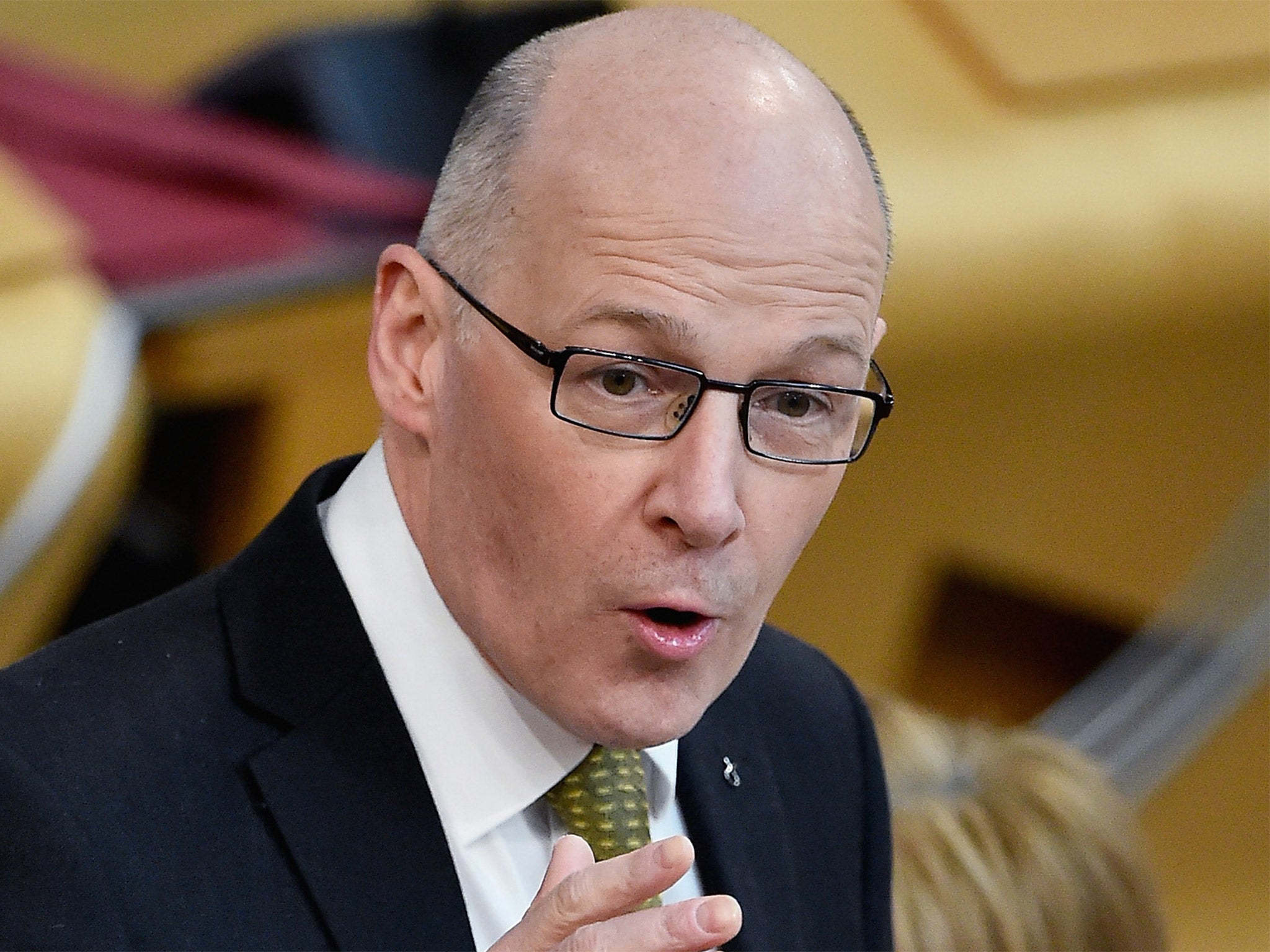 Deputy First Minister John Swinney addresses Scottish Parliament in Edinburgh