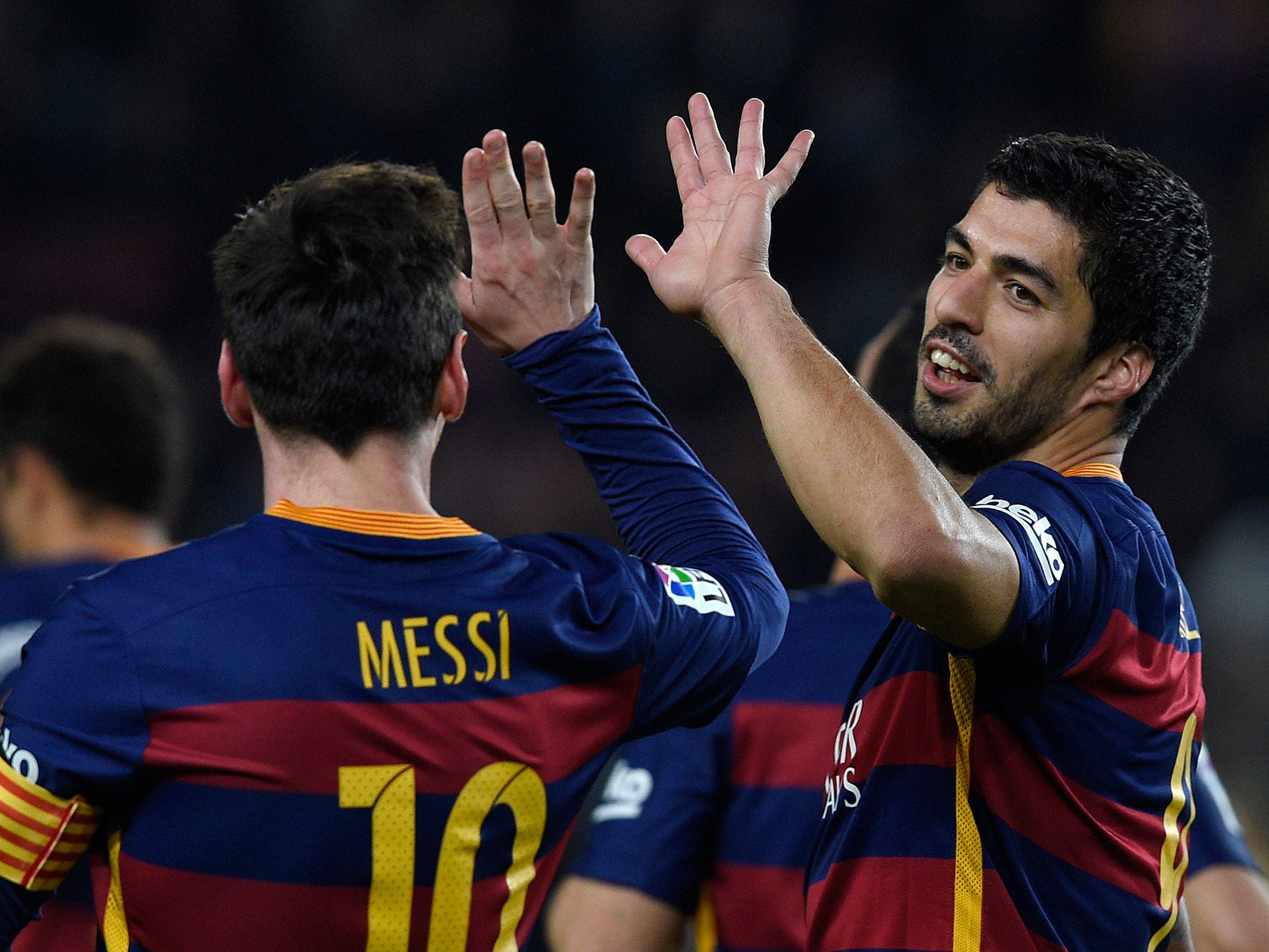 Luis Suarez and Lionel Messi celebrate