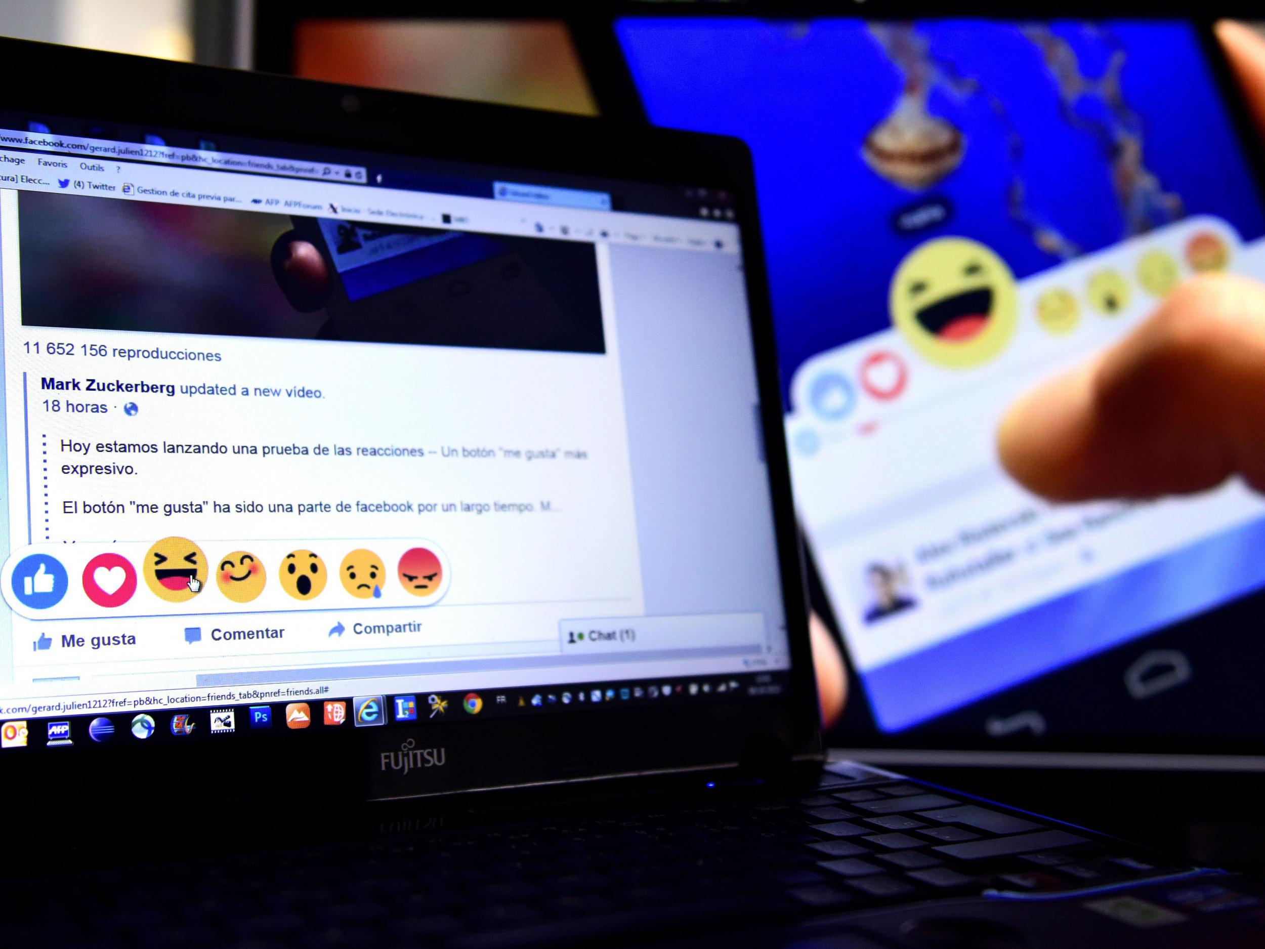 A Facebook user tries out the site's new 'Reactions' feature