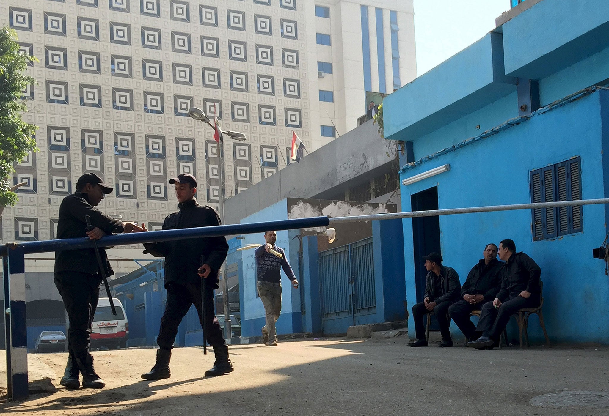 Policemen guard in front of a morgue where the body of an Italian Giulio Regeni is kept in Cairo, Egypt, February 4, 2016.