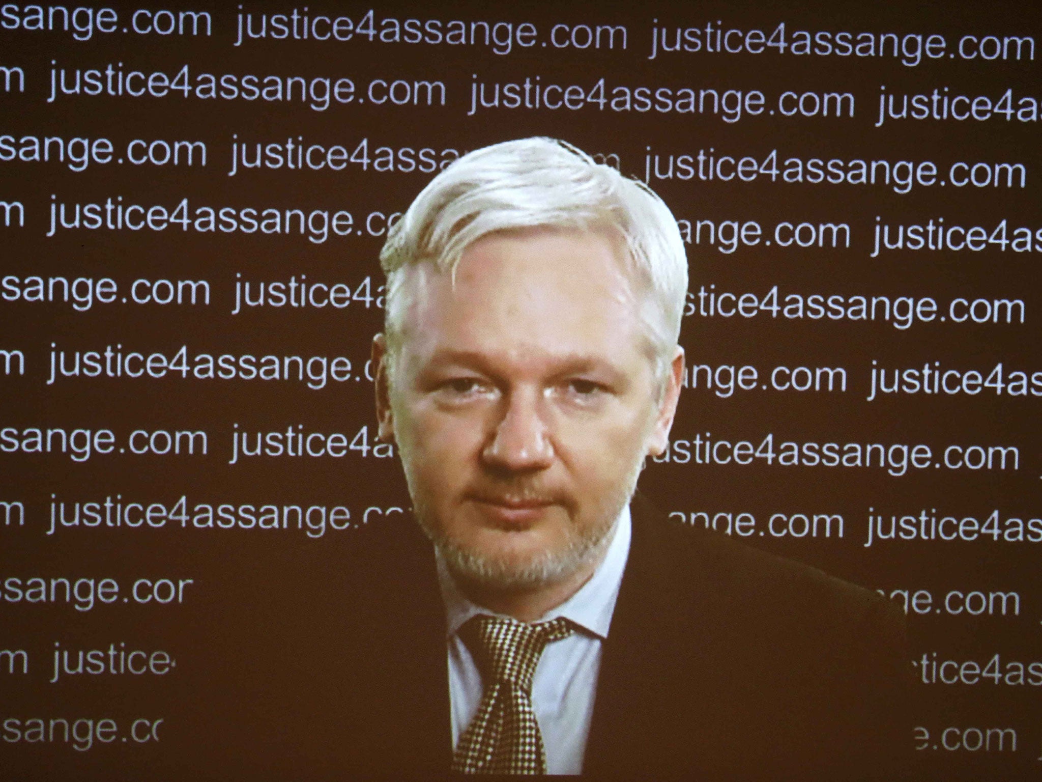 WikiLeaks founder Julian Assange appears on screen via video link during a news conference at the Frontline Club in London, Britain February 5, 2016.