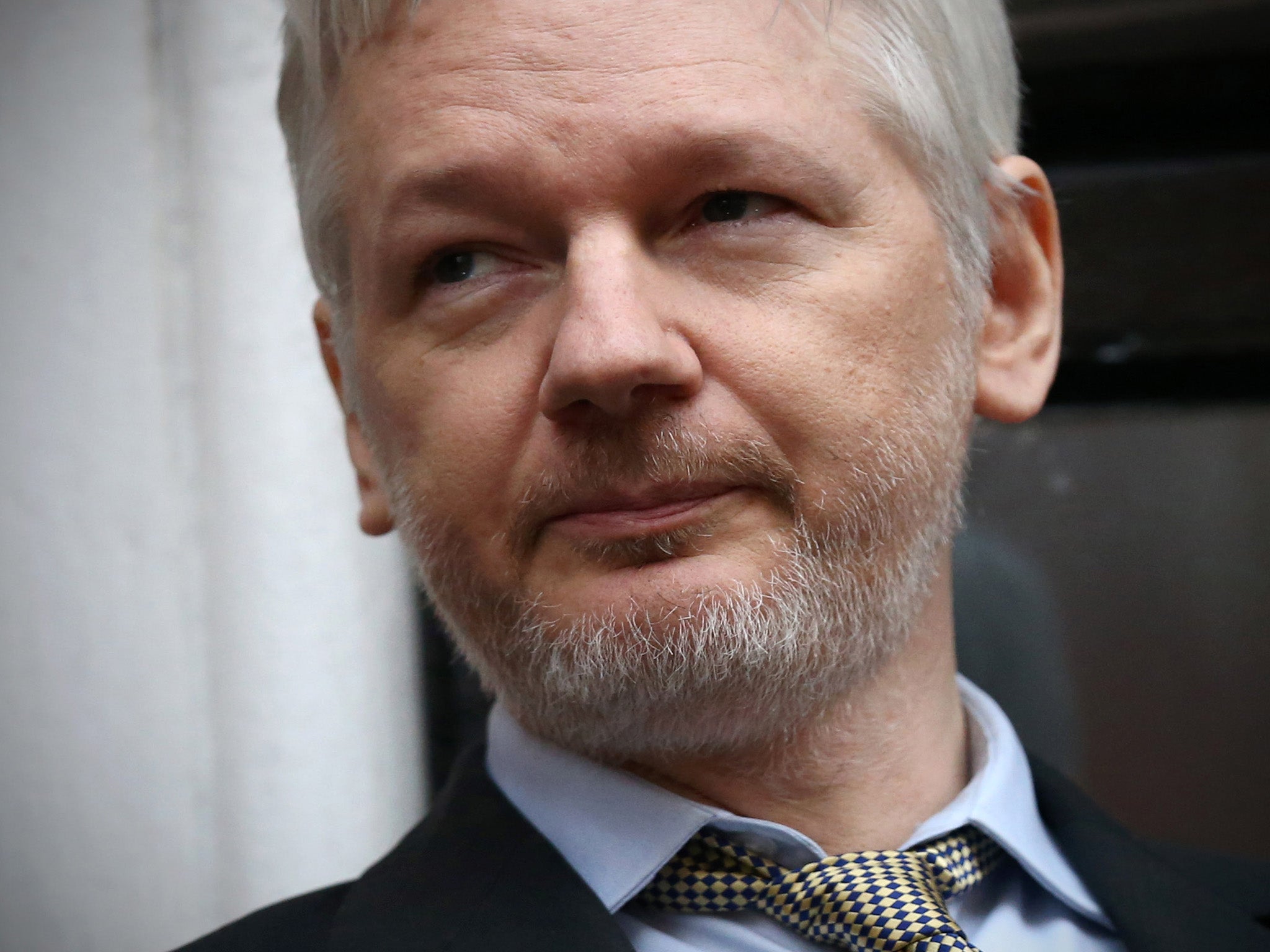 Julian Assange speaks from the balcony of the Ecuadorian embassy where he continues to seek asylum following an extradition request from Sweden in 2012