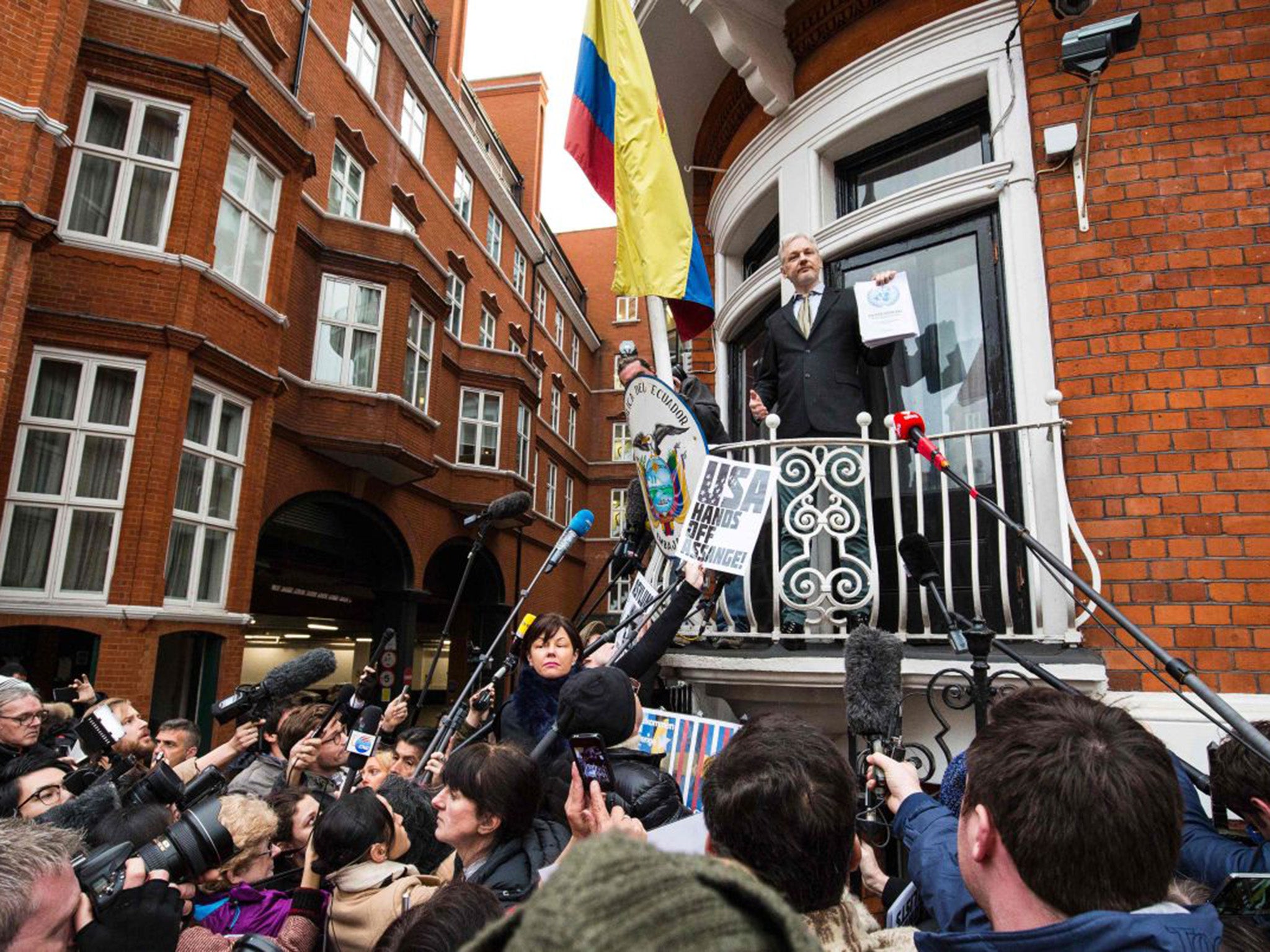 WikiLeaks founder Julian Assange (C) addresses media and supporters from the balcony of Ecuador's embassy in central London,