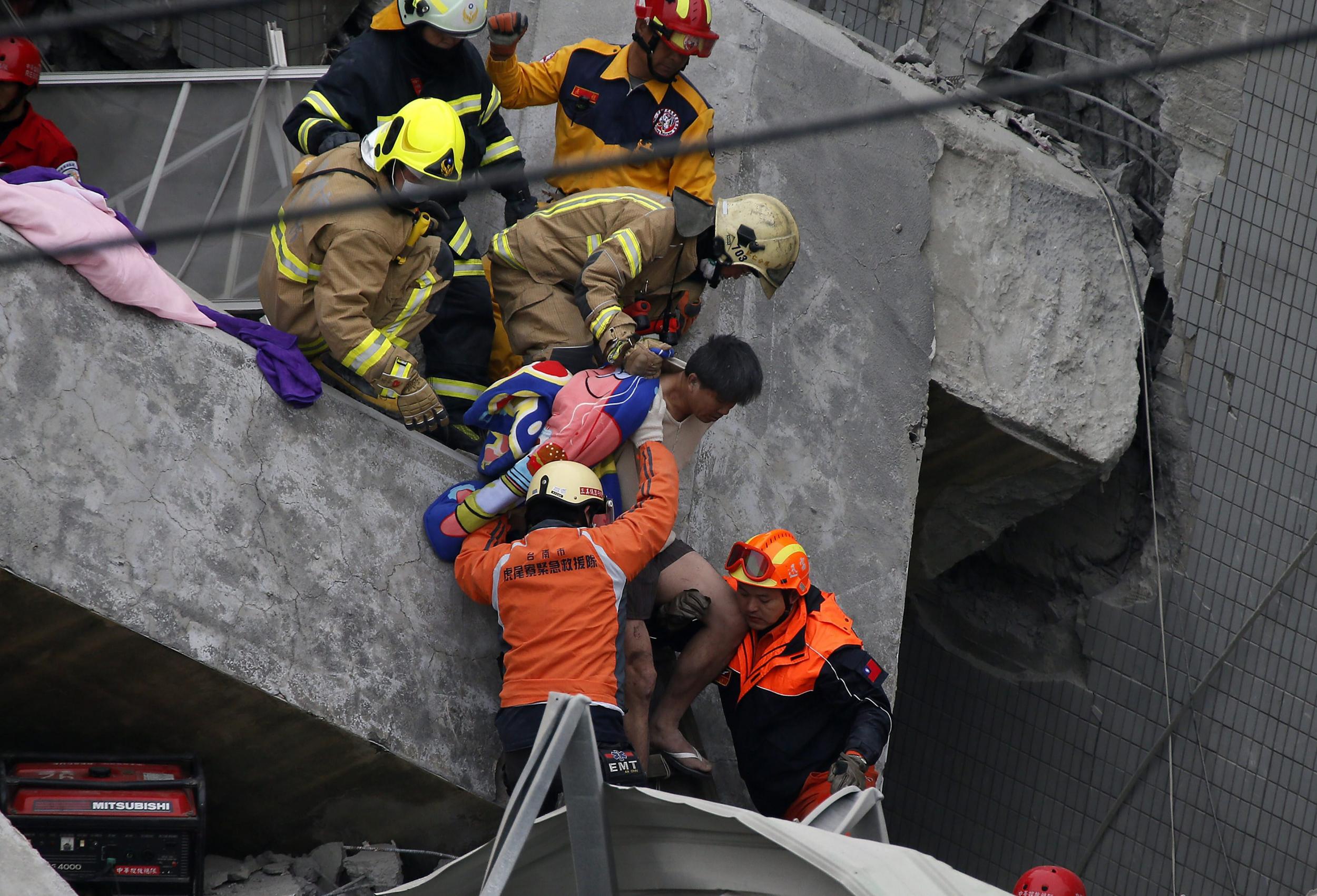 A man is rescued from his collapsed flat in Tainan City