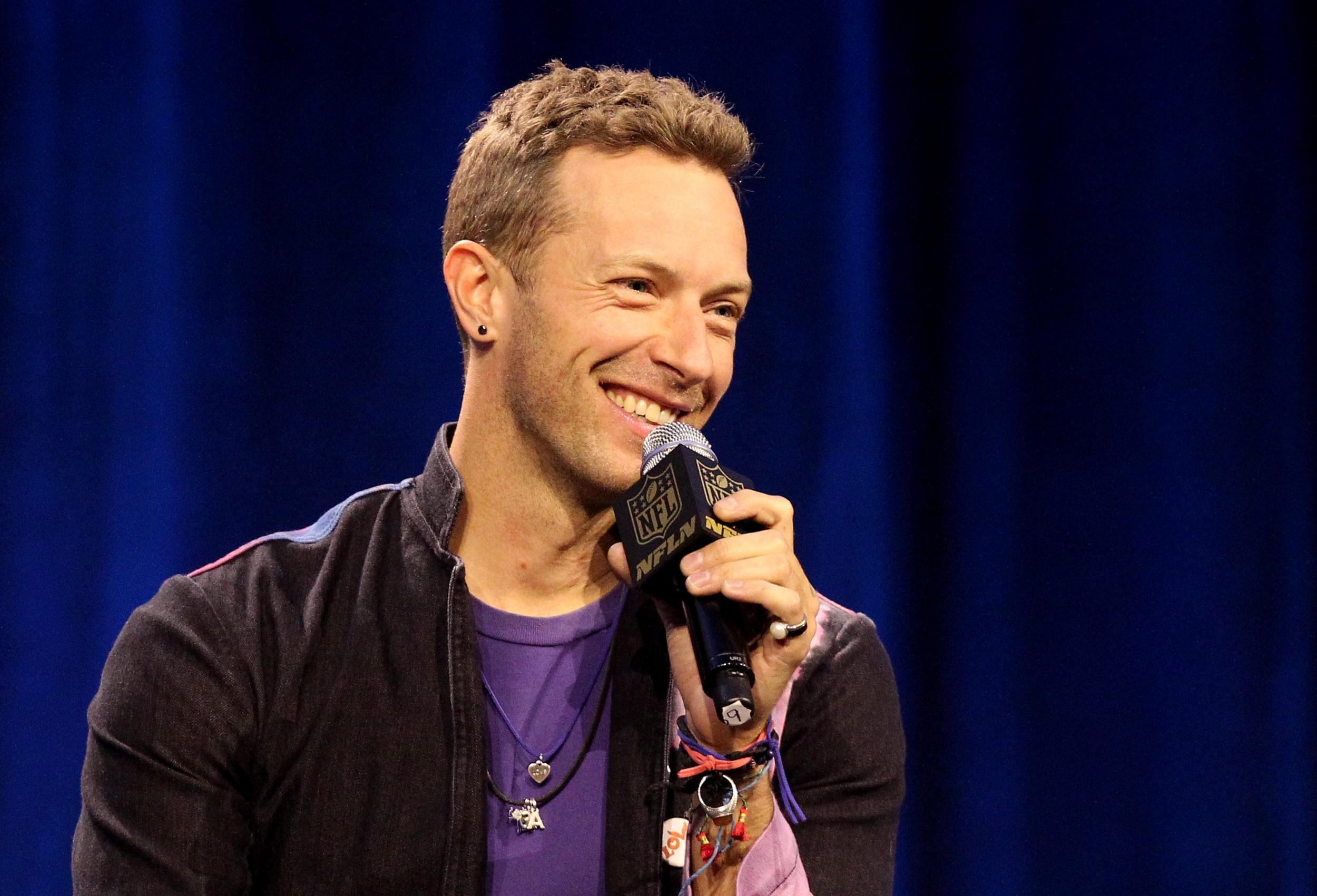 Chris Martin answers questions at the Superbowl press conference