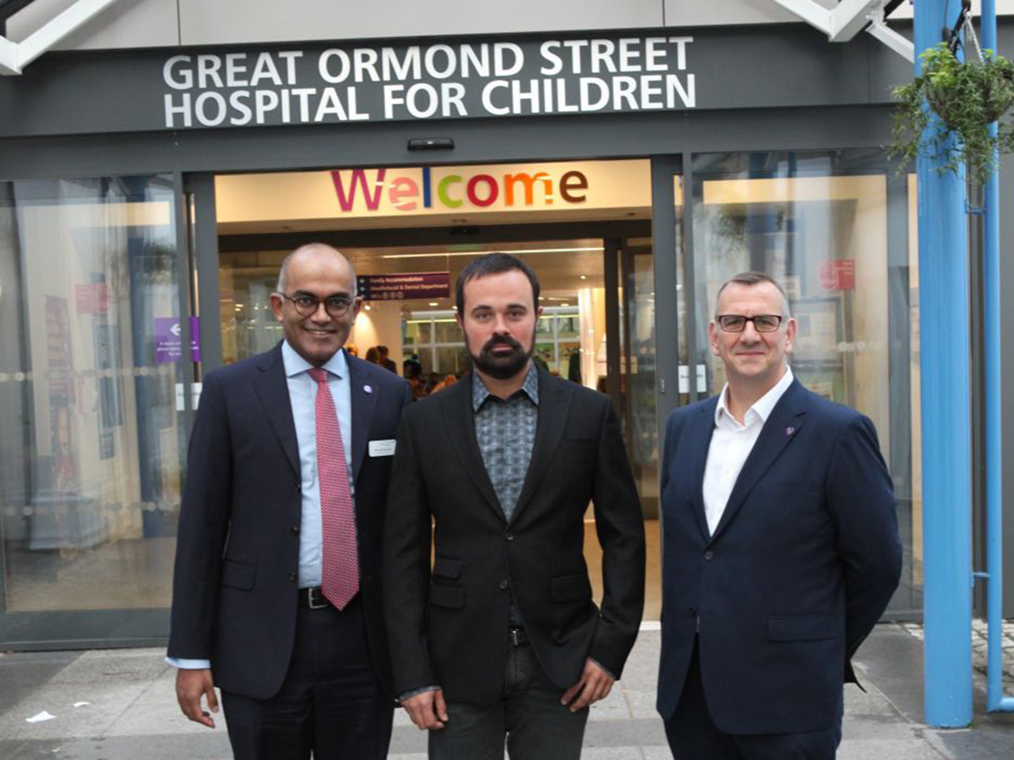 Dr Vinod Diwakar, medical director of GOSH, left, with Evgeny Lebedev, centre, and CEO of GOSH Tim Johnson, right