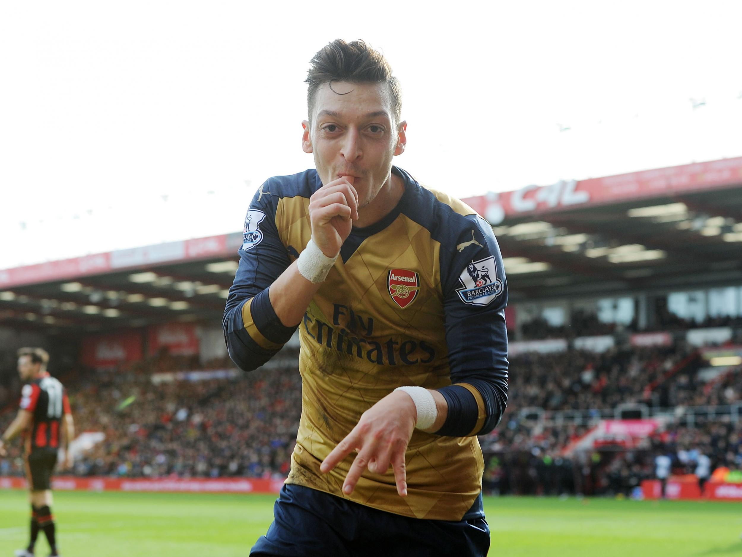 Mesut Ozil celebrates into the camera after scoring against Bournemouth