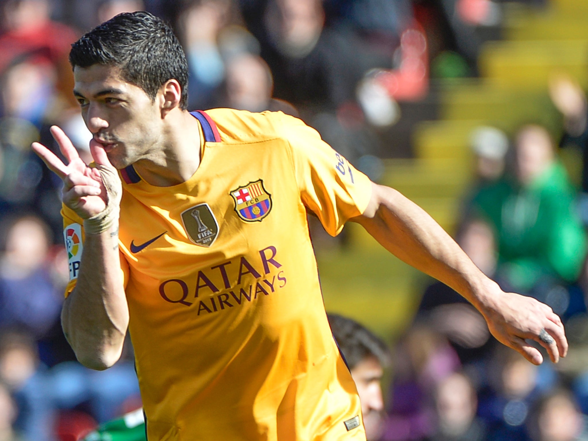 Barcelona forward Luis Suarez celebrates sealing his side's 2-0 victory over Levante