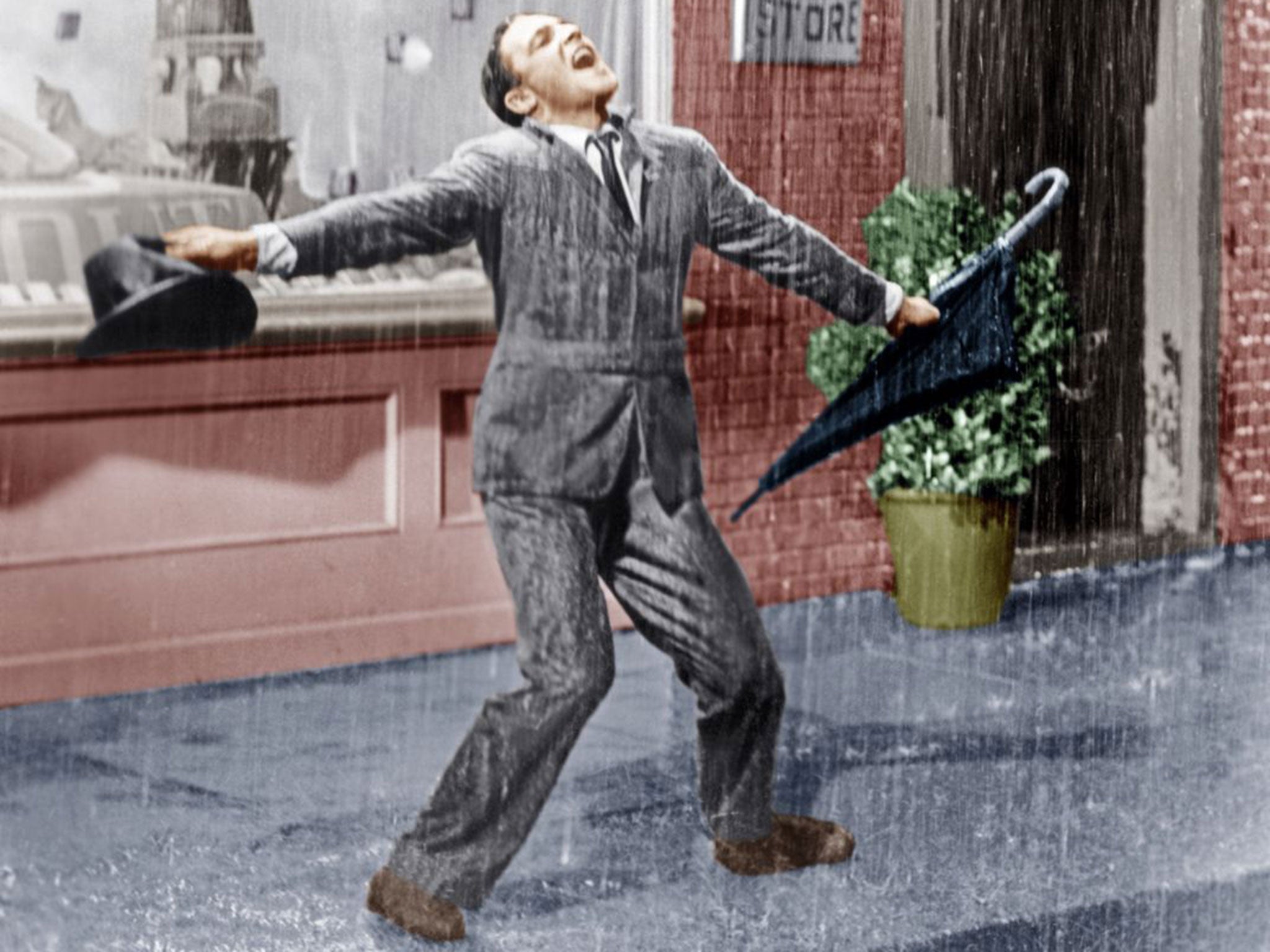 Gene Kelly in Singin' In The Rain from 1952. Researchers are exploring techniques which will allow viewers to sense “raindrops” on their hands or wind on their face as they are watching on television