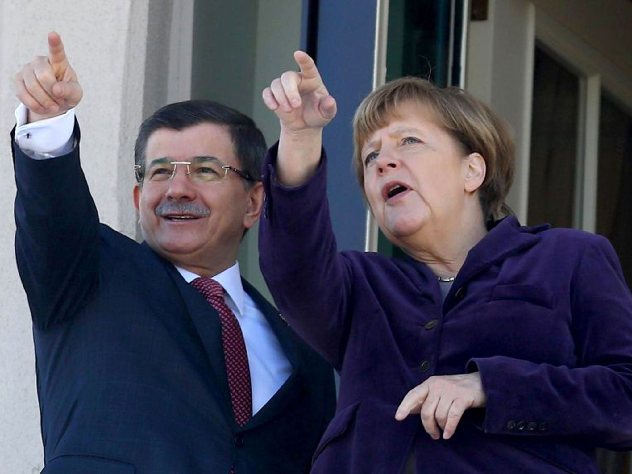 Turkish Prime Minister Ahmet Davutoglu meets German Chancellor Angela Merkel in Ankara for a joint press conference on the conflict in Syria