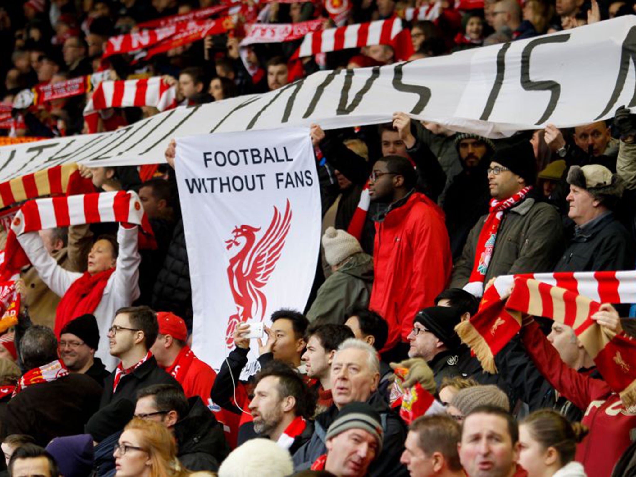 Liverpool fans hold up a banner protesting at prices during the 2-2 draw with Sunderland