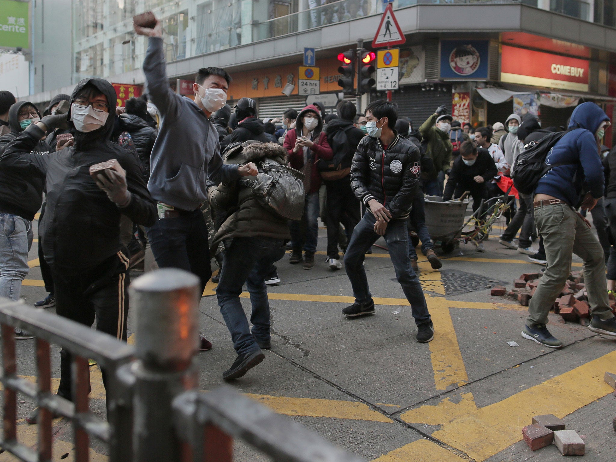 Protesters hurl bricks at police