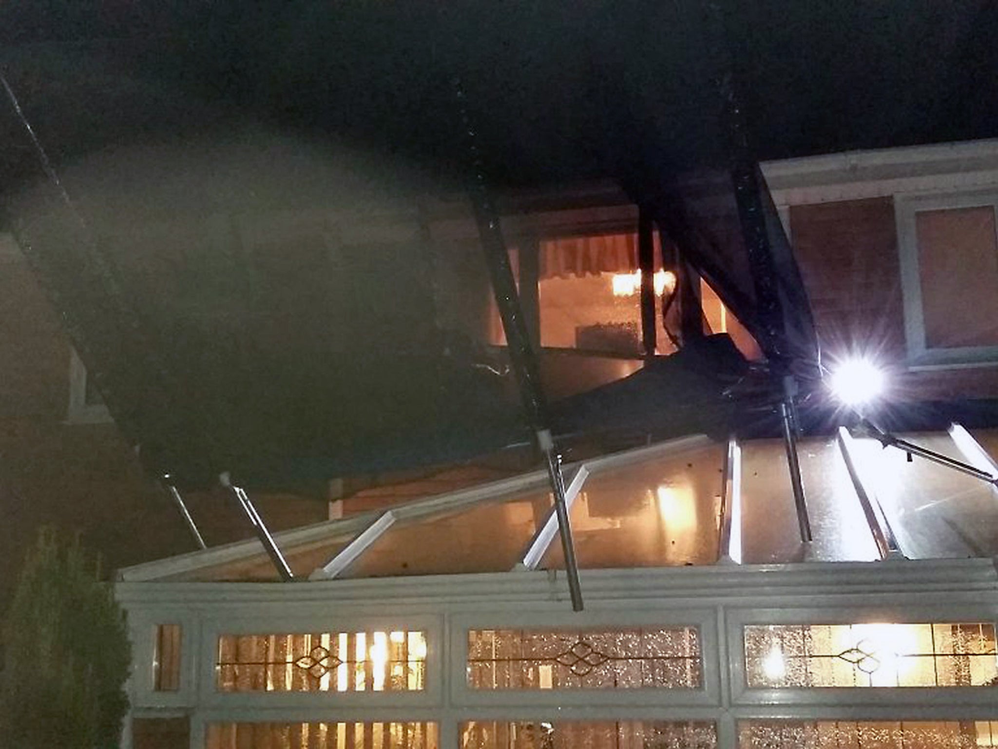 &#13;
A house in Hampshire where a crew from Gosport Fire Station were called to help as a trampiline got stuck on the roof of a conservatory following high wings &#13;