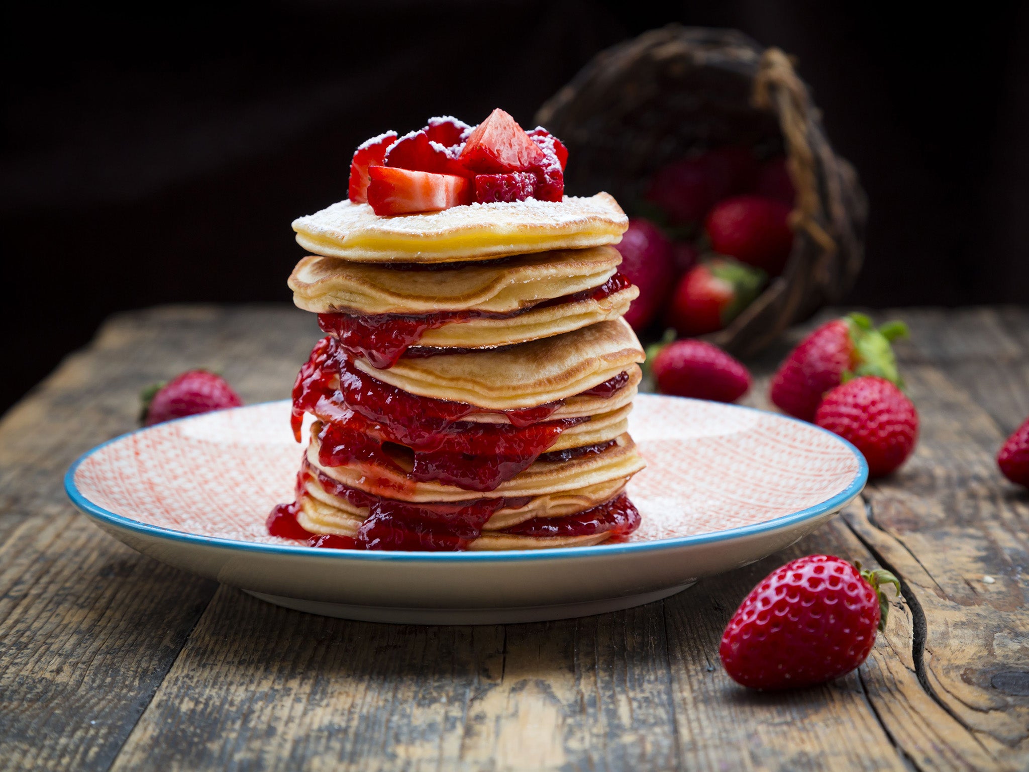 Pancakes with strawberry sauce and strawberries