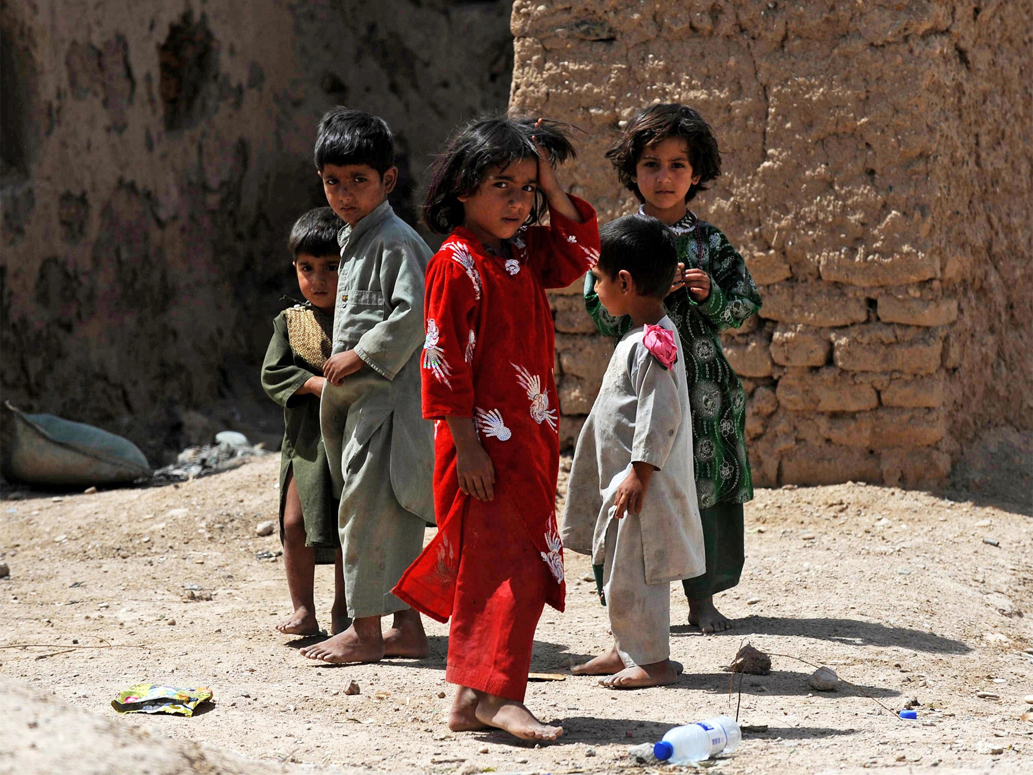 Children in Helmand province, Afghanistan. Some children deported from Britain claim they had been left homeless, chased by the Taliban, kidnapped, ransomed and beaten