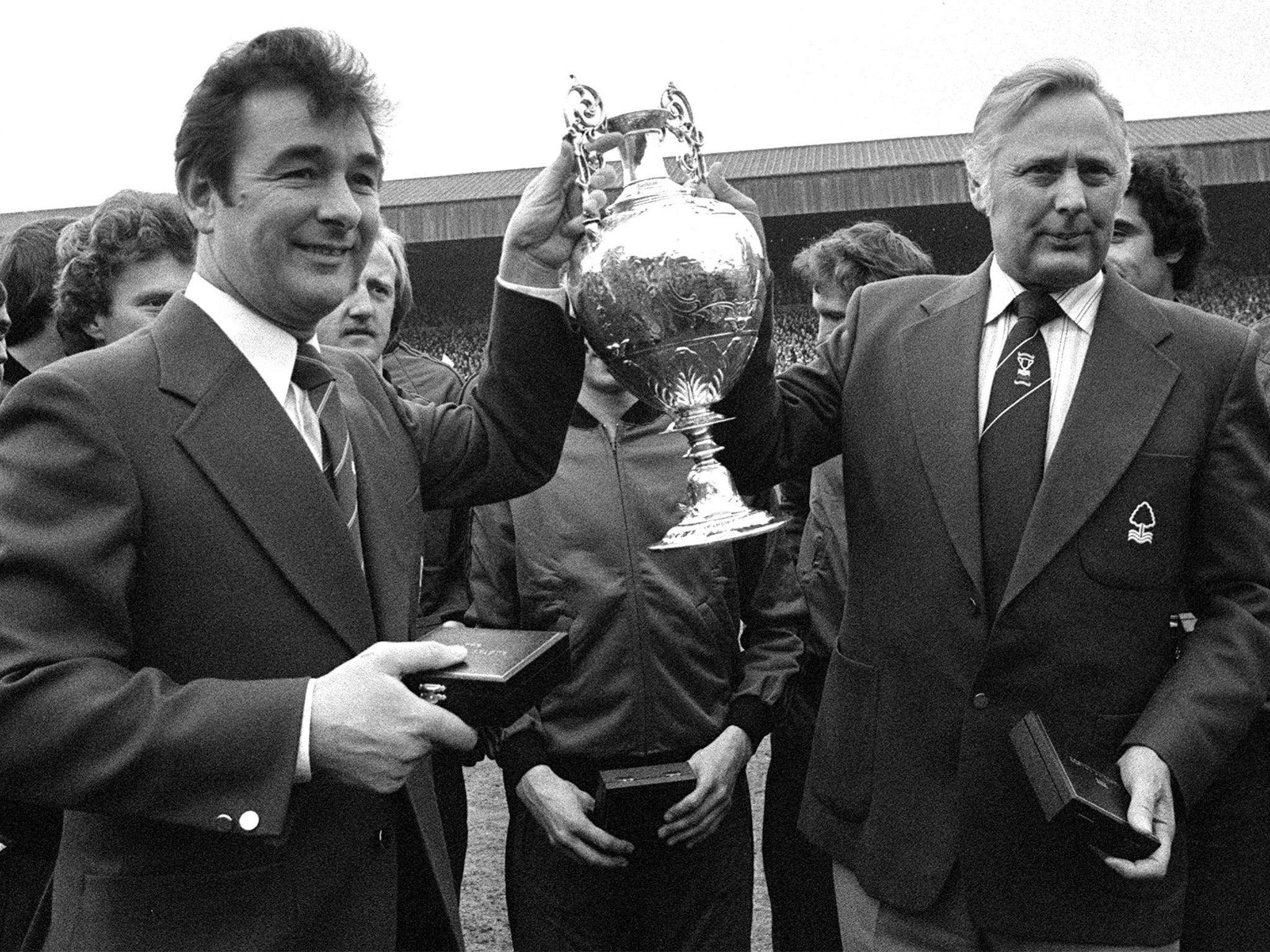 Manager Brian Clough, left, and assistant Peter Taylor celebrate Forest’s title triumph