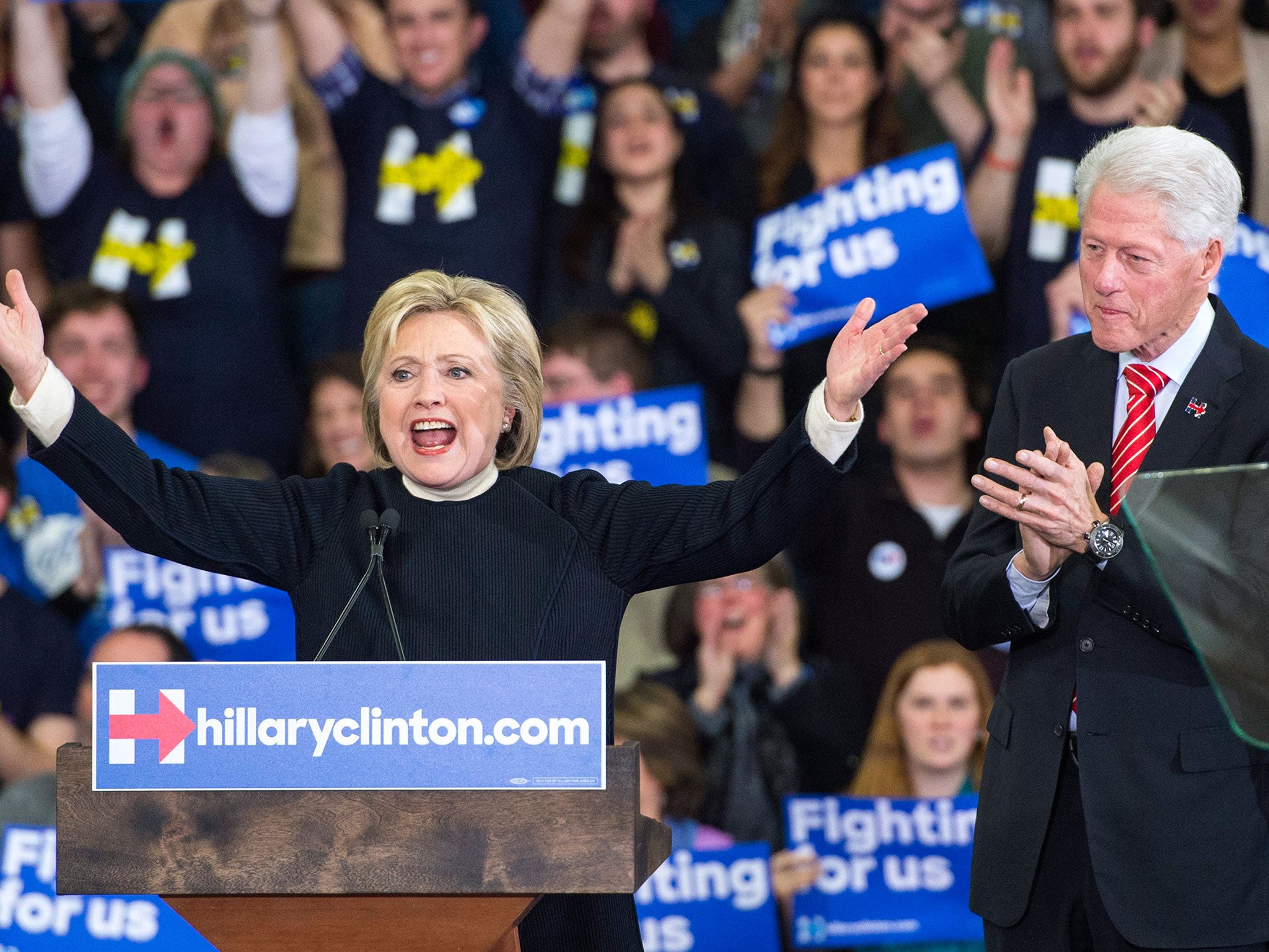 Hillary Clinton delivers her concession speech in the New Hampshire primary as husband Bill watches on